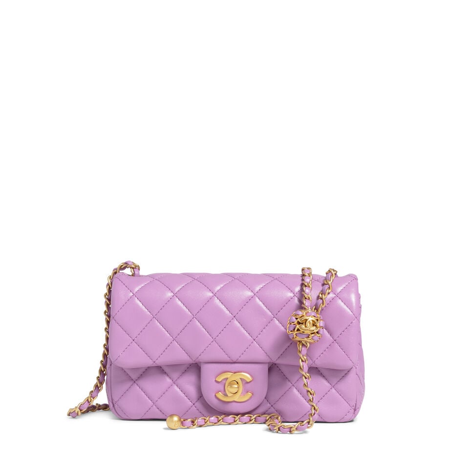 CHANEL: PURPLE LAMBSKIN MINI RECTANGLE PEARL CRUSH FLAP BAG 2022: CHANEL: PURPLE LAMBSKIN MINI RECTANGLE PEARL CRUSH FLAP BAG 2022 • Purple Quilted Lambskin Leather Exterior • Brushed Gold Tone Hardware • Adjustable Leather and Chain Shoulder Strap