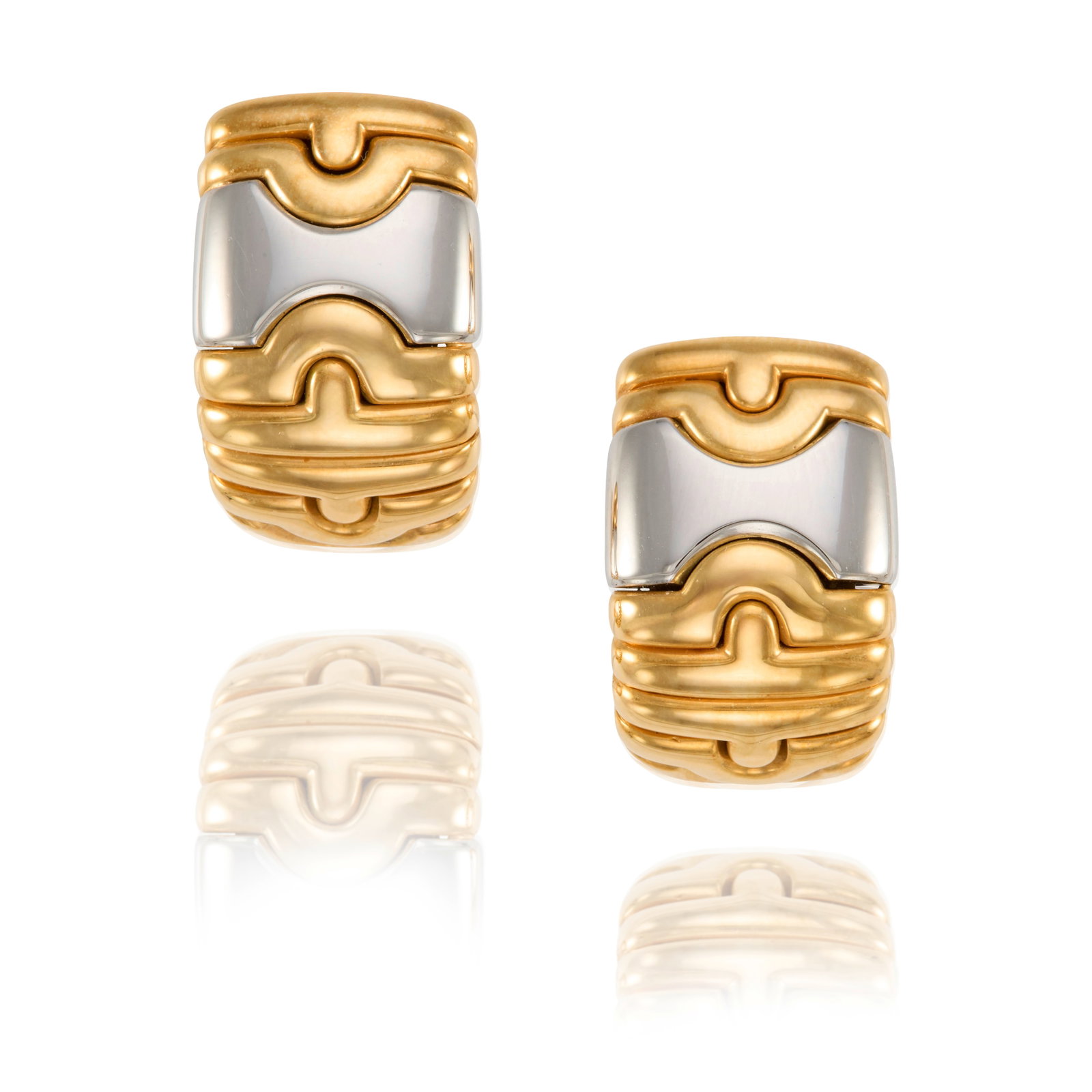 BULGARI: A PAIR OF 18K GOLD AND STAINLESS STEEL 'PARENTESI' EARCLIPS: BULGARI: A PAIR OF 18K GOLD AND STAINLESS STEEL 'PARENTESI' EARCLIPS Each of geometric design; signed Bulgari; with Italian registered trademark; measures 3/4 in. Footnotes: OVERALL CONDITION: Metal s