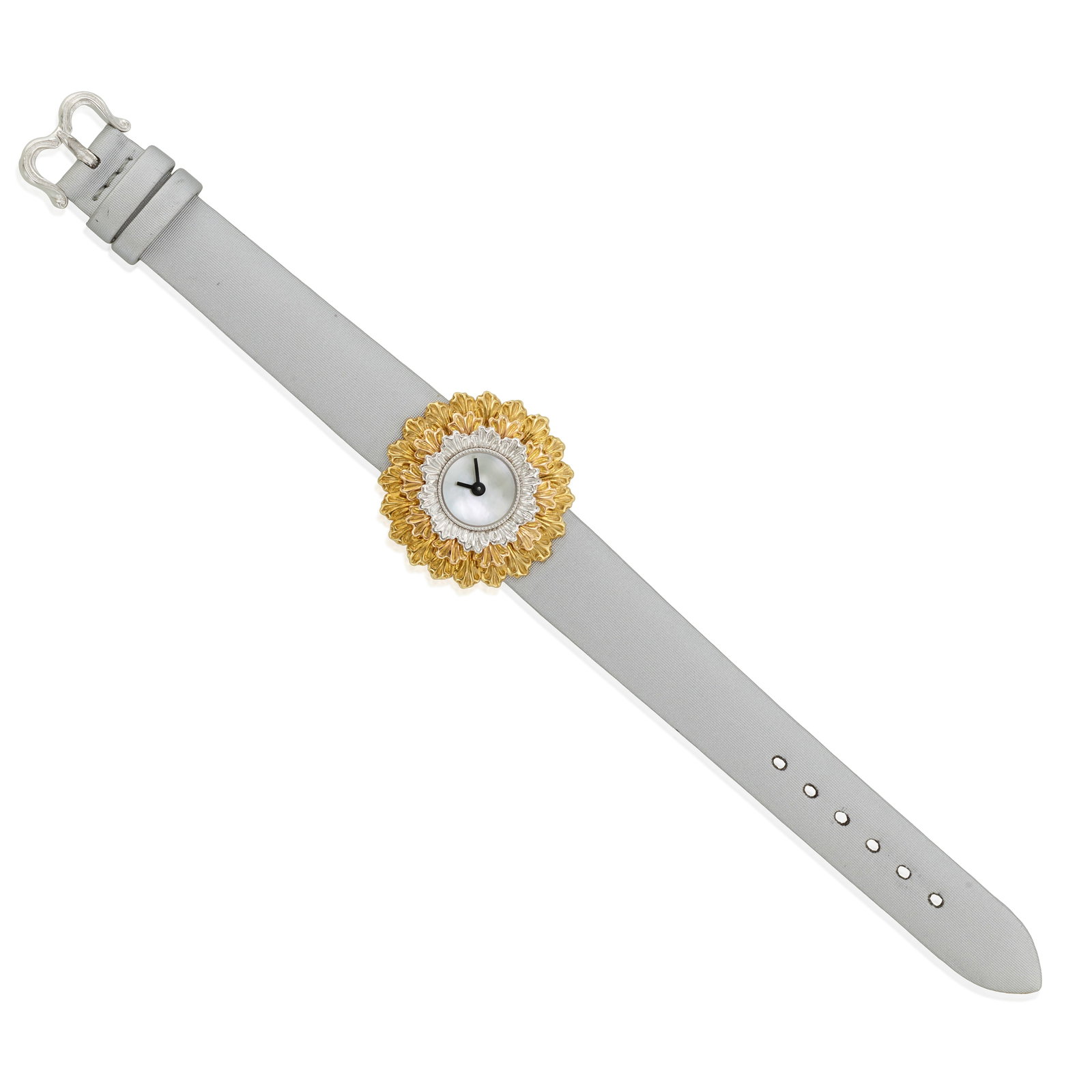 BUCCELLATI: AN 18K BICOLOR GOLD AND MOTHER-OF-PEARL WRISTWATCH: BUCCELLATI: AN 18K BICOLOR GOLD AND MOTHER-OF-PEARL WRISTWATCH With quartz movement, the round dial set with mother-of-pearl, and the bezel set with textured gold and white gold, to a silk strap, long