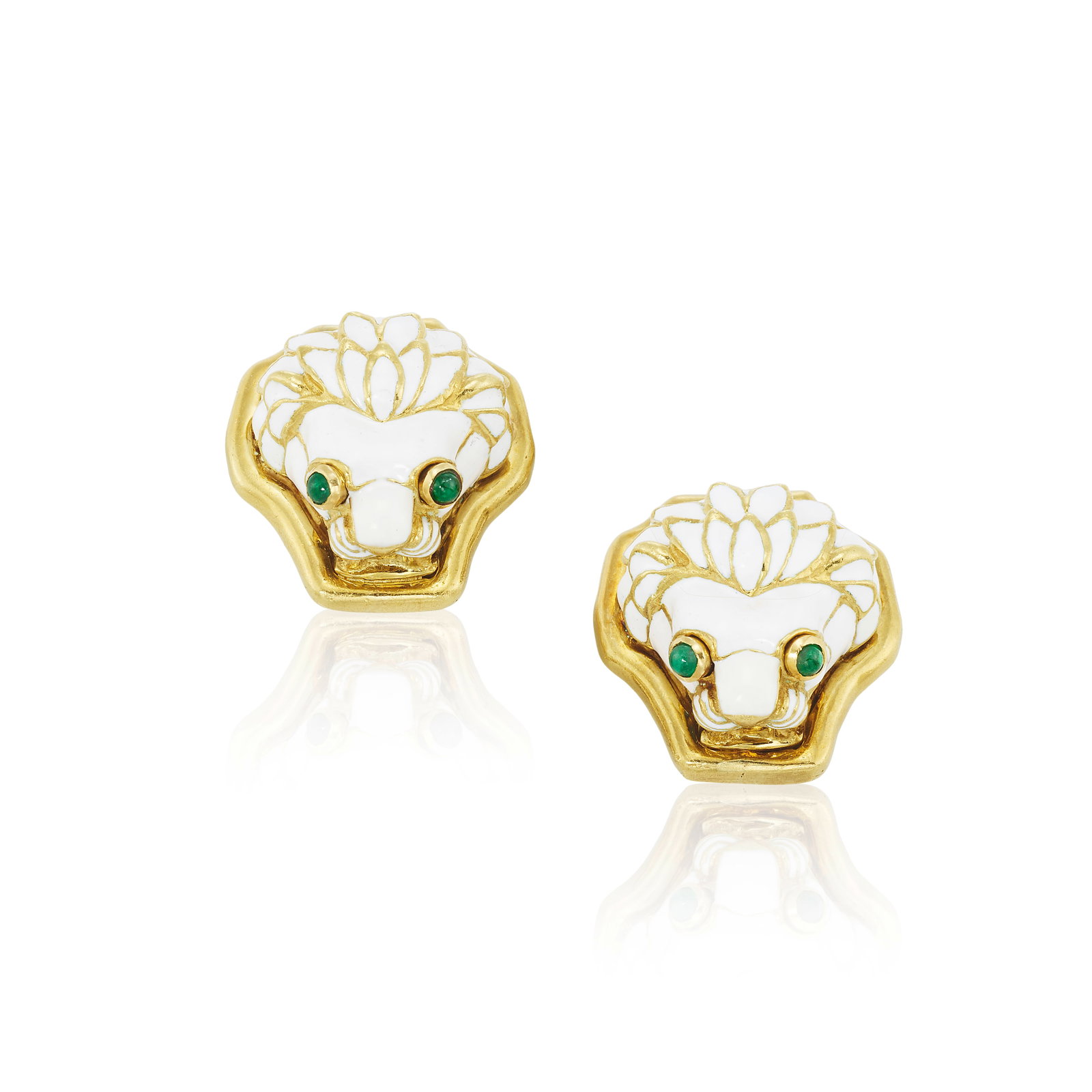 DAVID WEBB: A PAIR OF ENAMEL AND EMERALD EARCLIPS: DAVID WEBB: A PAIR OF ENAMEL AND EMERALD EARCLIPS Each designed as a lion's head of white enamel, with round cabochon emerald eyes; signed WEBB; mounted in 18K gold; length 7/8 in Footnotes: OVERALL C