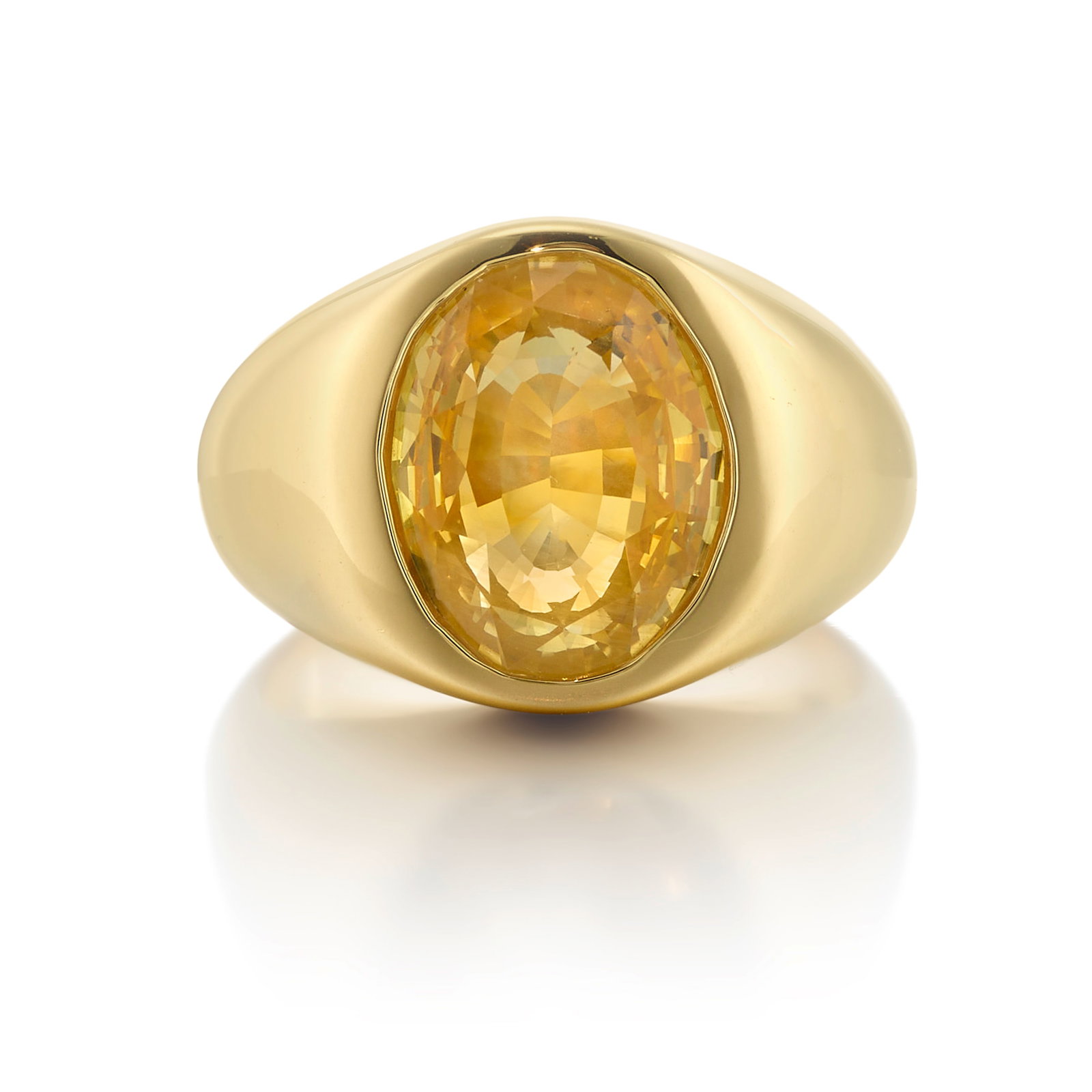 AN 18K GOLD AND ORANGY YELLOW SAPPHIRE RING: AN 18K GOLD AND ORANGY YELLOW SAPPHIRE RING Centering an oval-shaped, mixed-cut, Orangy Yellow sapphire, weighing 8.09 carats; size 6 3/4 Footnotes: Accompanied by GIA Report 1236878034, dated March