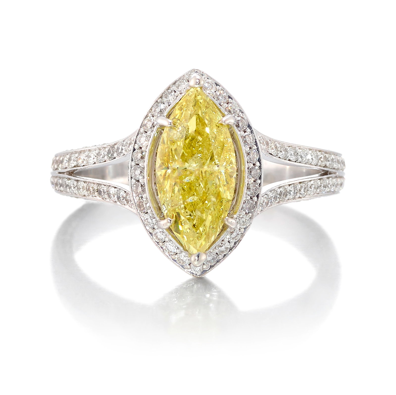 A FANCY INTENSE YELLOW DIAMOND RING: A FANCY INTENSE YELLOW DIAMOND RING Centering a marquise-shaped, Fancy Intense Yellow diamond, weighing 2.29 carats, in a surround of round brilliant-cut diamonds; estimated accent diamond weight