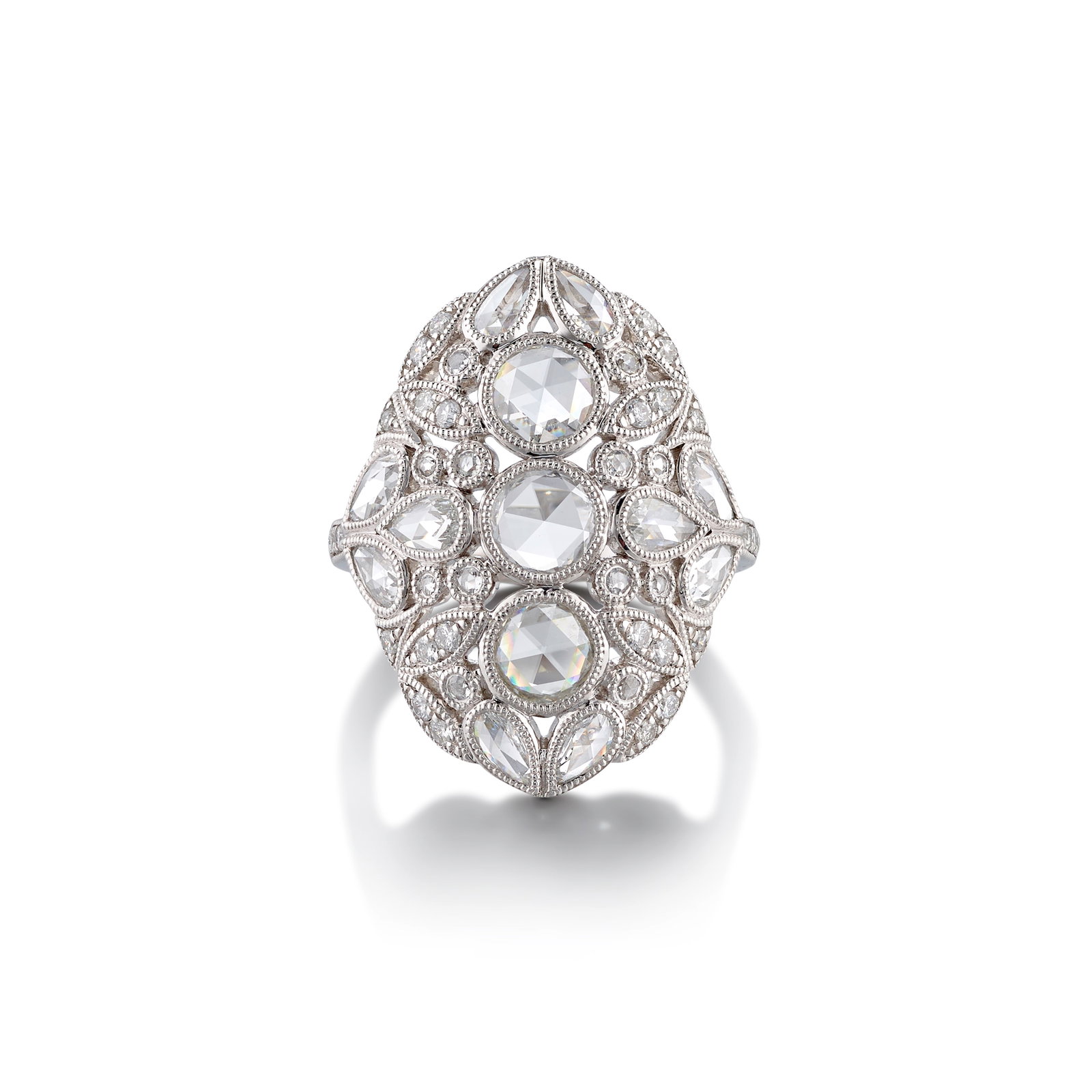 A PLATINUM AND DIAMOND RING: A PLATINUM AND DIAMOND RING Of openwork, foliate-inspired design, set throughout with round and pear-shaped, rose-cut diamonds, further accented with round brilliant-cut diamonds; estimated center