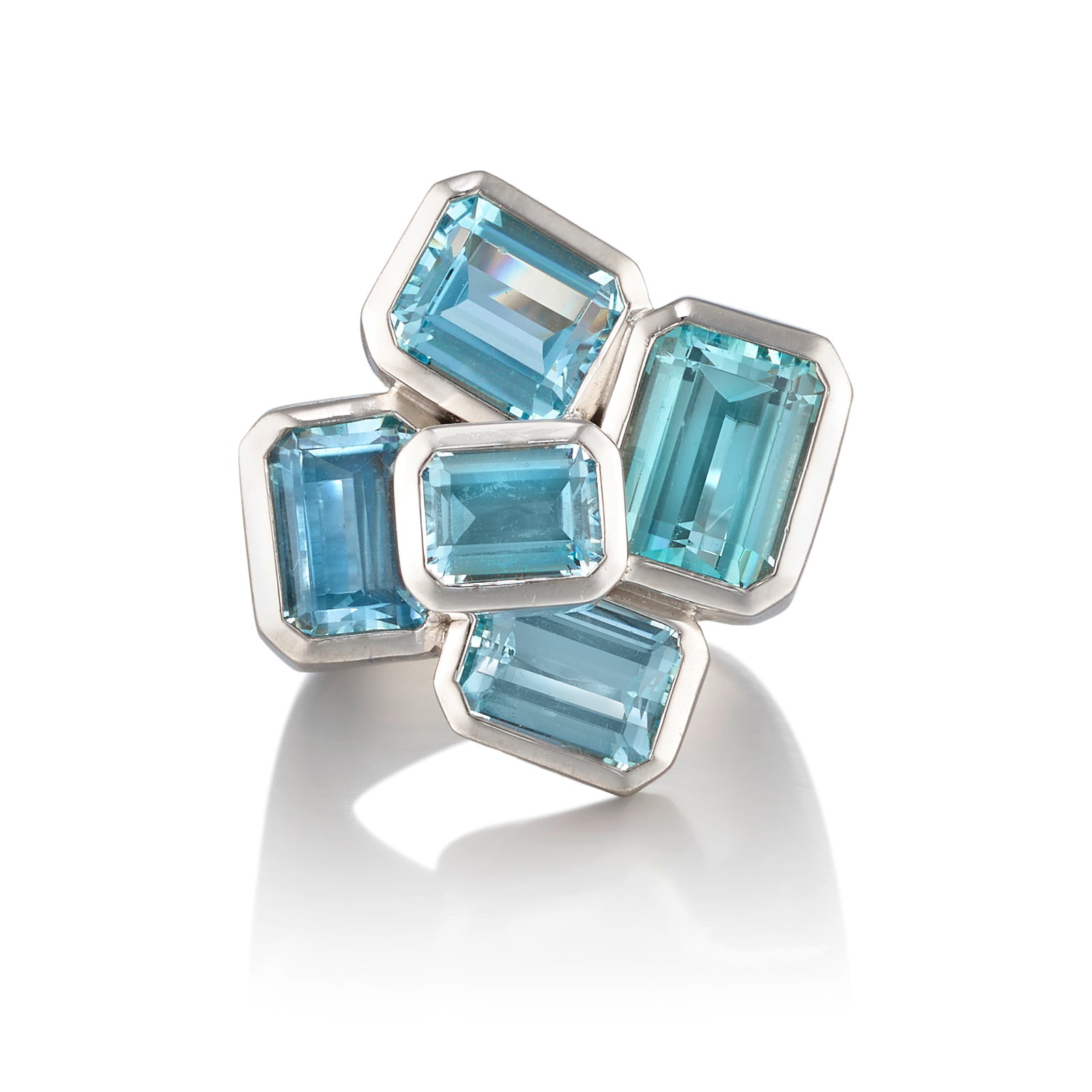 H.STERN: AN 18K WHITE GOLD AND AQUAMARINE RING: H.STERN: AN 18K WHITE GOLD AND AQUAMARINE RING Of dimensional design, set with octagonal step-cut aquamarines, the shank of a brushed finish; with maker's mark; size 5 1/4 on mandrel Footnotes: