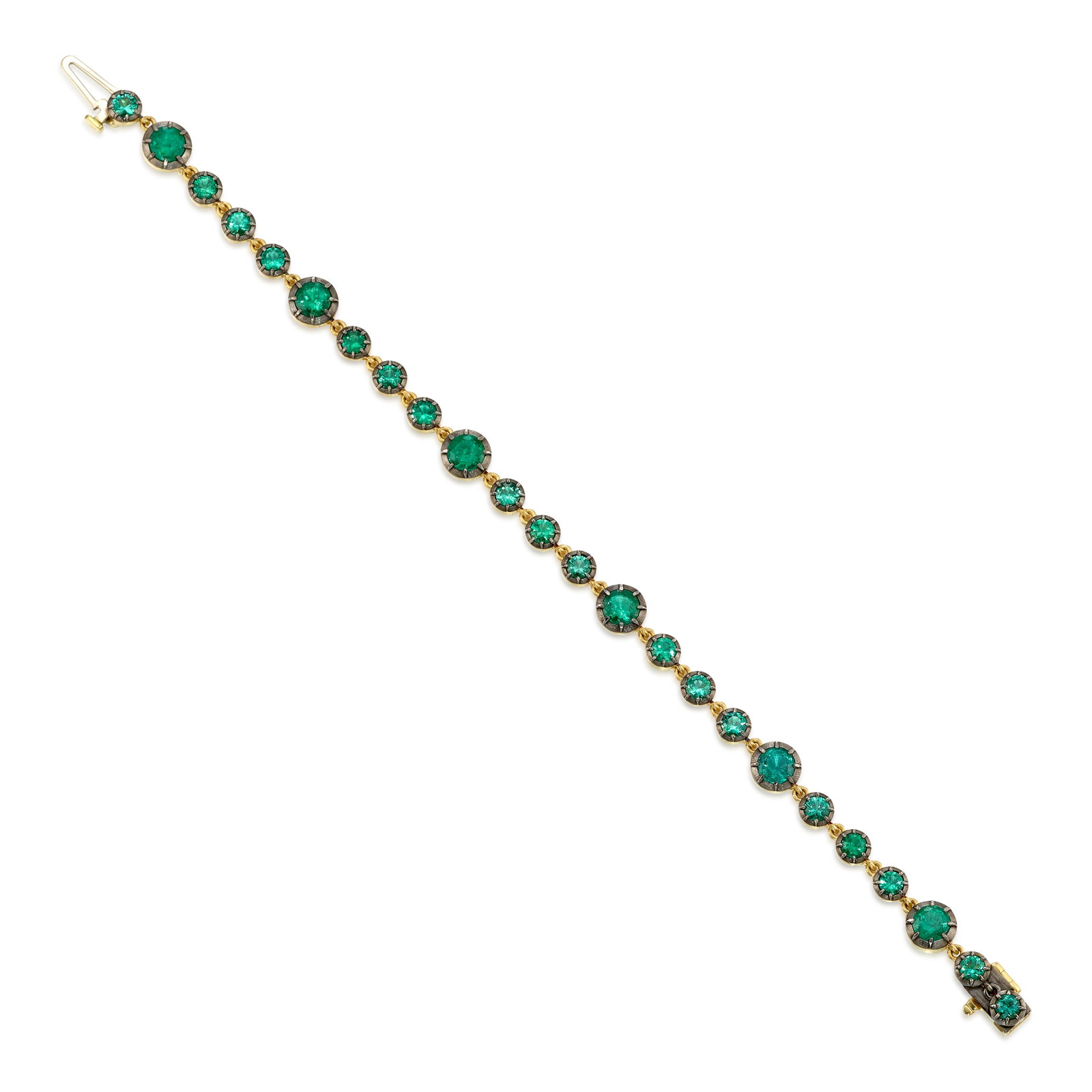 AN EMERALD BRACELET: AN EMERALD BRACELET A line bracelet alternating round emeralds of varying sizes; estimated total emerald weight 4.85 carats; fabricated in rhodium-topped 18k gold; length 7 in. Footnotes: OVERALL
