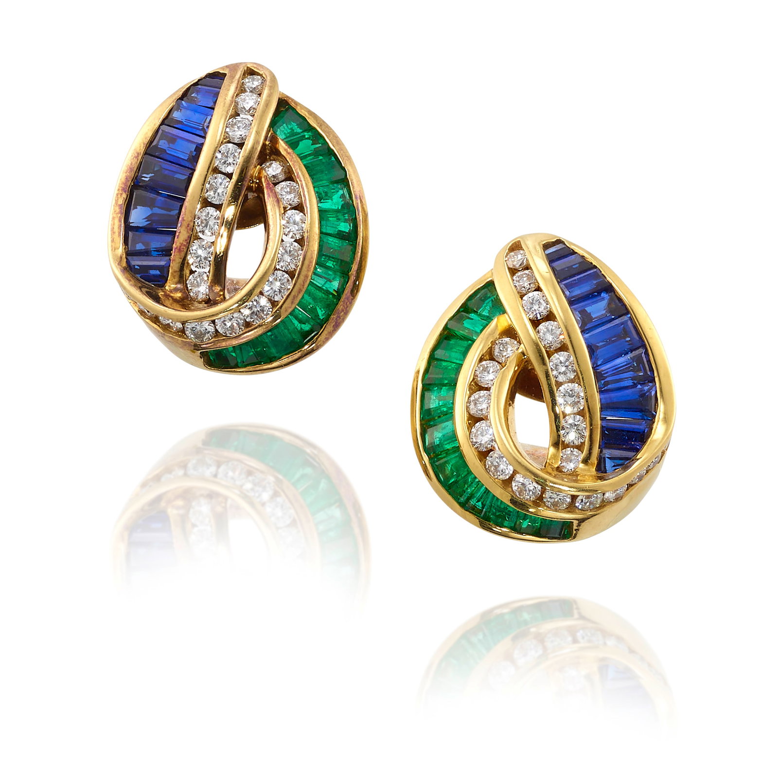 CHARLES KRYPELL: A PAIR OF 18K GOLD, GEM-SET AND DIAMOND EARCLIPS: CHARLES KRYPELL: A PAIR OF 18K GOLD, GEM-SET AND DIAMOND EARCLIPS Each designed as knots, set with round brilliant-cut diamonds and tapered-baguette and baguette-cut sapphires and emeralds; signed Kry