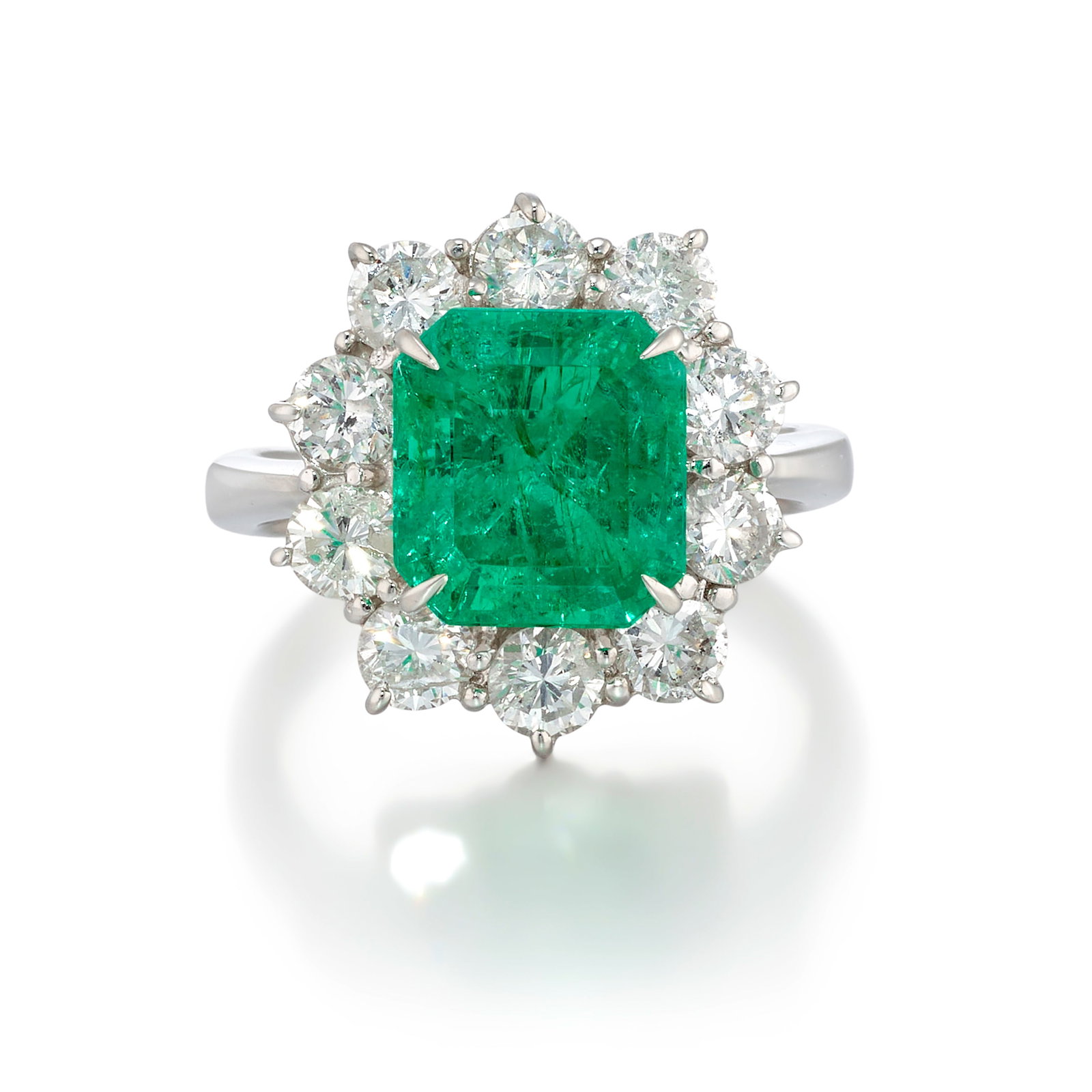 A PLATINUM, EMERALD AND DIAMOND RING (1 of 1)