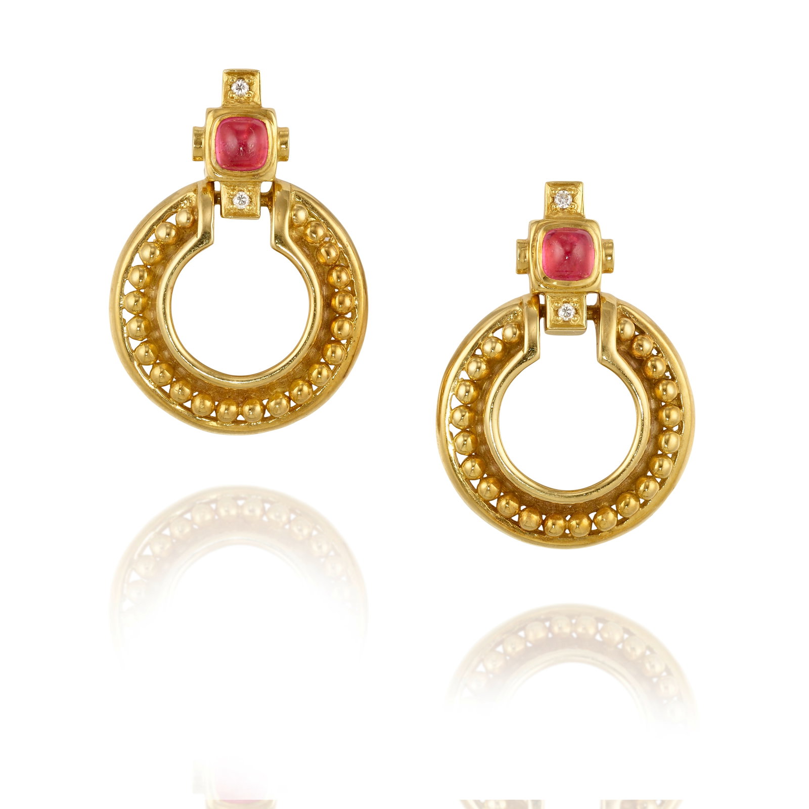 A PAIR OF 18K GOLD, TOURMALINE AND DIAMOND EARCLIPS: A PAIR OF 18K GOLD, TOURMALINE AND DIAMOND EARCLIPS The surmounts accented with square, sugarloaf cabochon pink tourmalines and round brilliant-cut diamonds, the circular pendant drops accented with