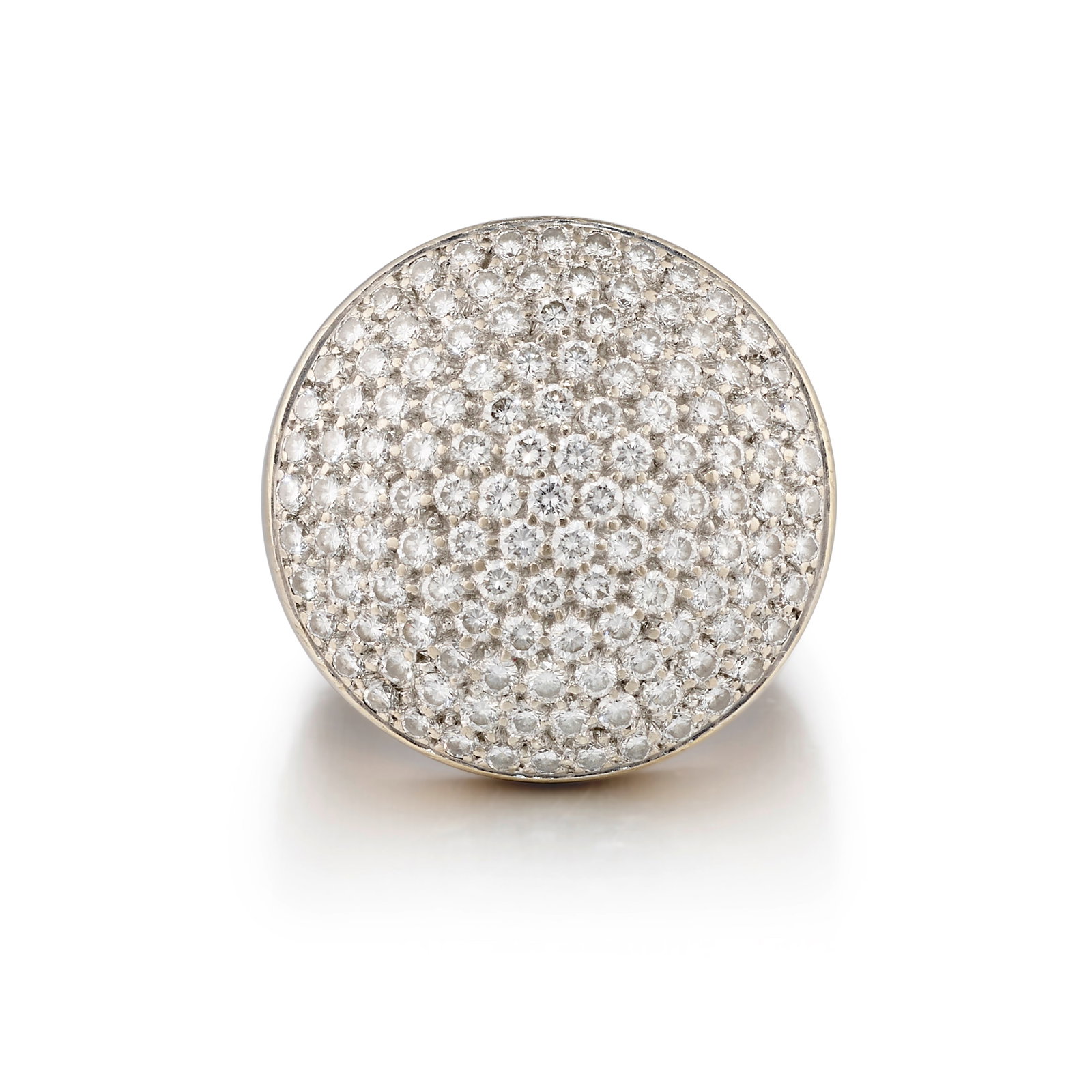 CARTIER: AN 18K WHITE GOLD AND DIAMOND 'JETON SAUVAGE' RING, FRANCE: CARTIER: AN 18K WHITE GOLD AND DIAMOND 'JETON SAUVAGE' RING, FRANCE Of circular, slightly domed form, pavé-set across with round brilliant-cut diamonds; signed Cartier; with partial maker's mark;