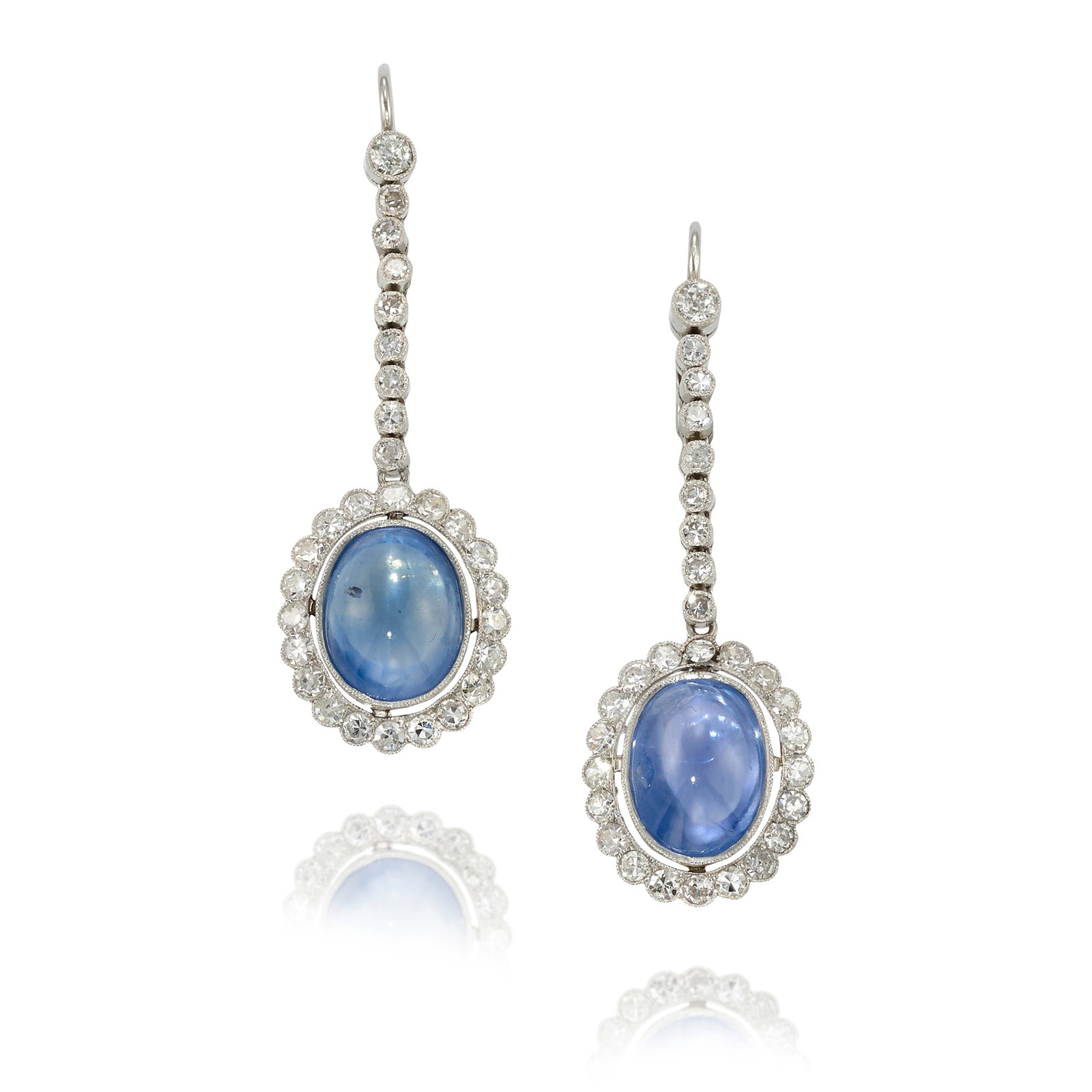 A PAIR OF SAPPHIRE AND DIAMOND EARRINGS, CIRCA 1910: A PAIR OF SAPPHIRE AND DIAMOND EARRINGS, CIRCA 1910 Comprising drops of oval-shaped, double-cabochon sapphires, in surrounds of and suspended from lines of old mine and single-cut diamonds; estimated 