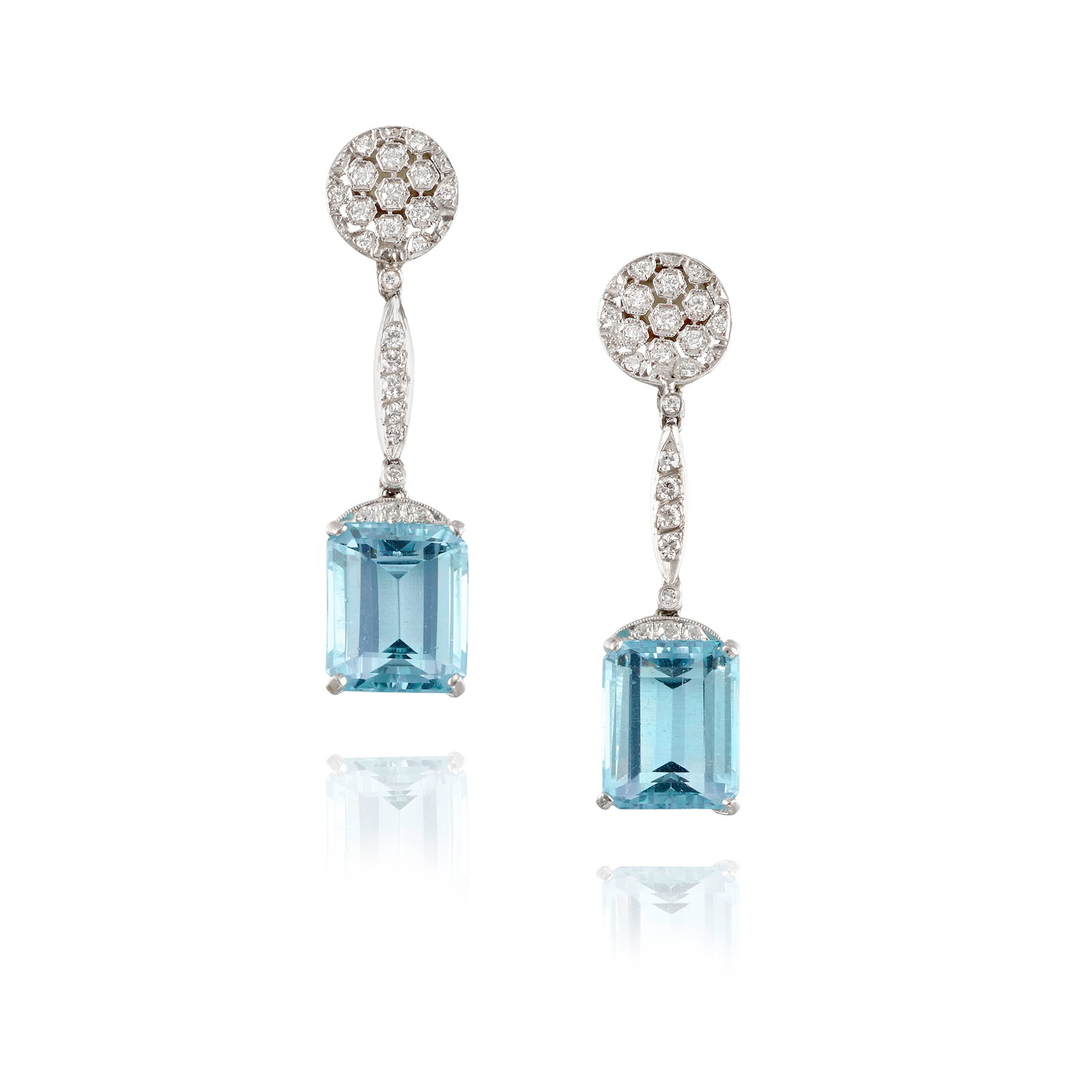 A PAIR OF AQUAMARINE AND DIAMOND EARCLIPS, CIRCA 1930: A PAIR OF AQUAMARINE AND DIAMOND EARCLIPS, CIRCA 1930 Each comprising octagonal, step-cut aquamarine drops, accented with transitional and single-cut diamonds; estimated total aquamarine weight 10.20 
