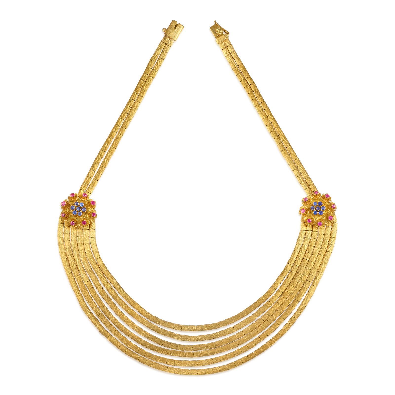 AN 18K GOLD, SAPPHIRE AND RUBY NECKLACE: AN 18K GOLD, SAPPHIRE AND RUBY NECKLACE The center section comprising six rows of flat, textured gold, gathered by floral stations accented with round sapphires and rubies, completed by a double-row