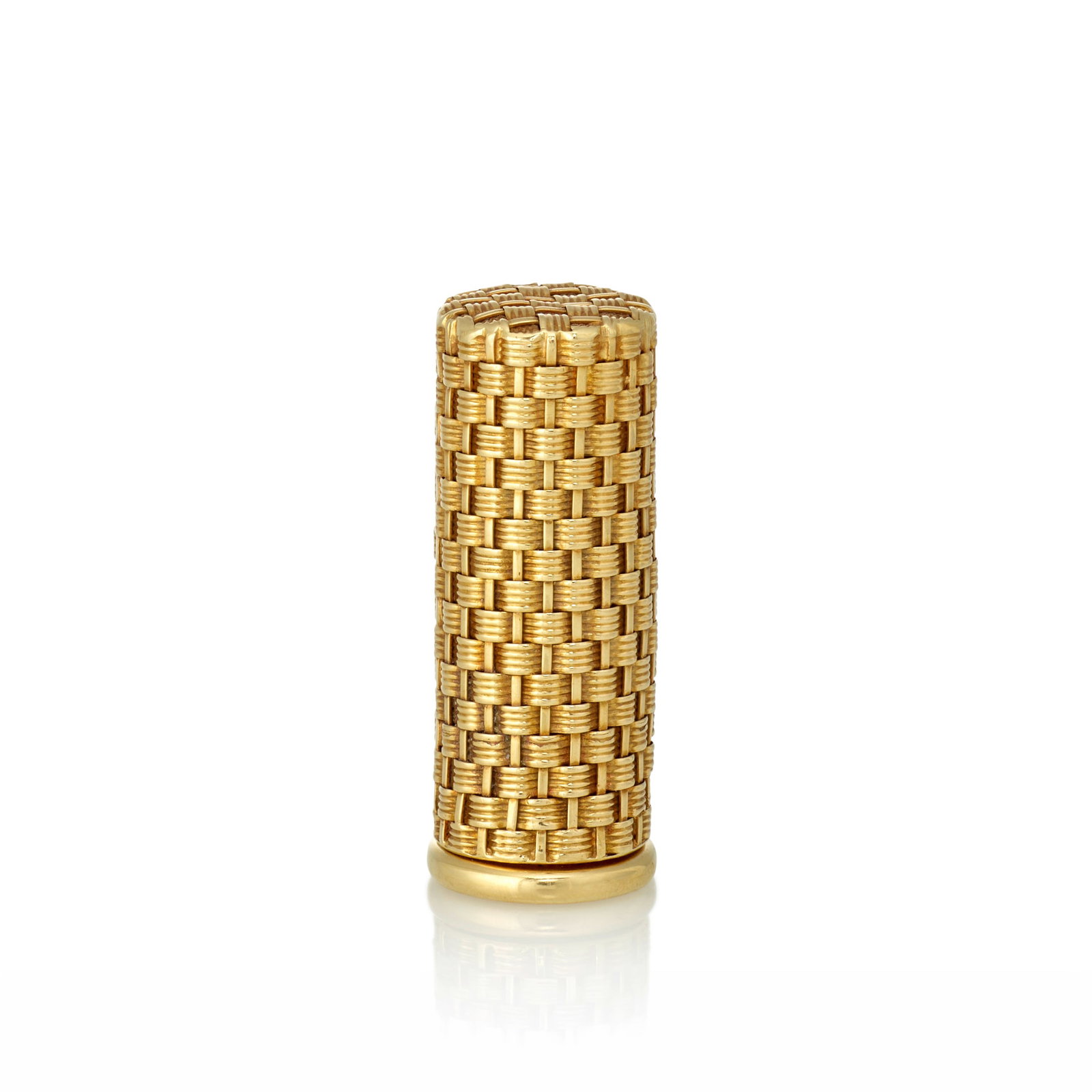 A GOLD LIPSTICK CASE, CIRCA 1955: A GOLD LIPSTICK CASE, CIRCA 1955 Of basket-weave design, containing a red lipstick; mounted in 18K gold; length 2 in Footnotes: OVERALL CONDITION: Metal unstamped and tested with XRF (X-ray fluorescen