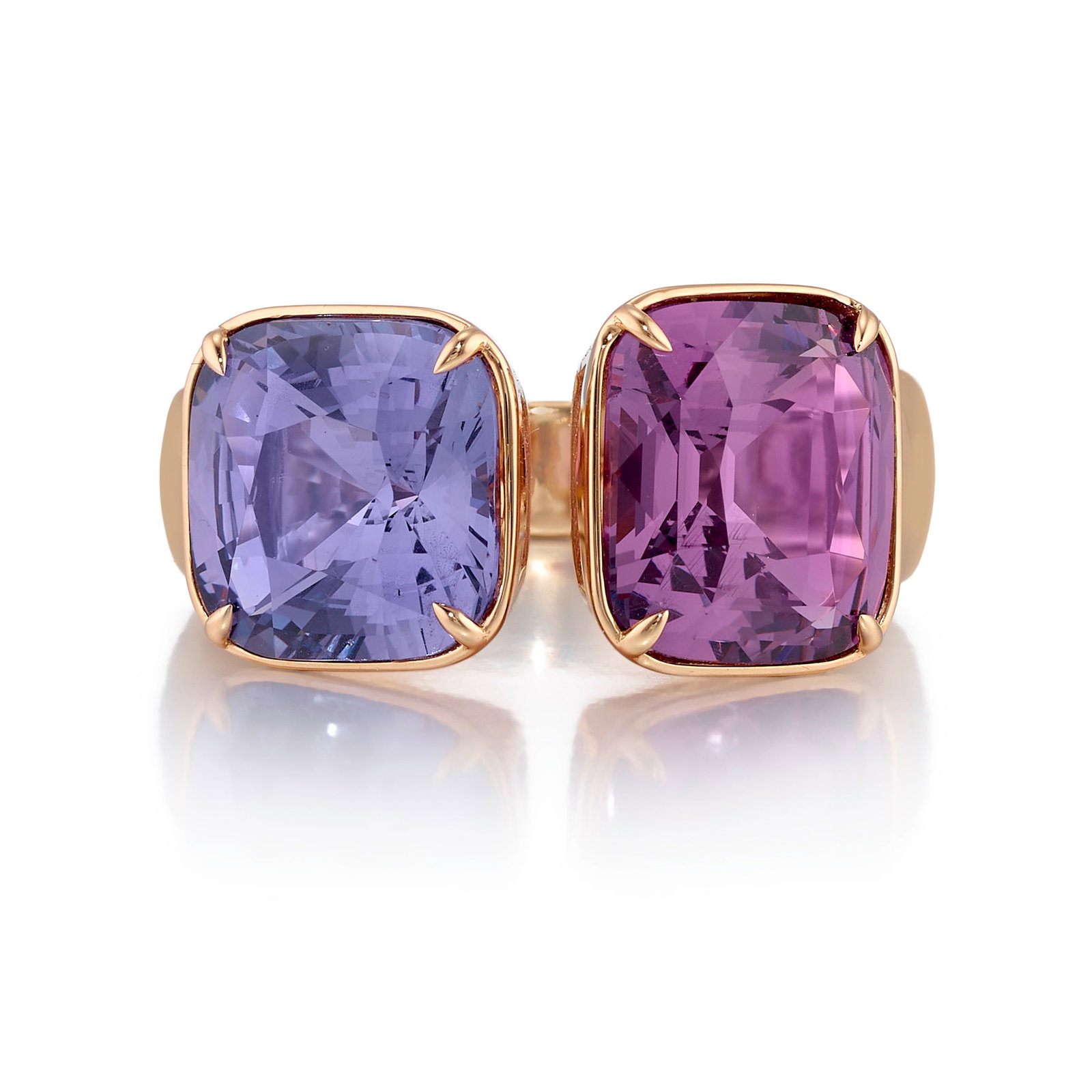 AN 18K PINK GOLD AND SPINEL RING: AN 18K PINK GOLD AND SPINEL RING Comprising a purple, rectangular cushion-shaped spinel, and a violet, square cushion-shaped spinel; estimated purple spinel weight 5.10 carats; estimated violet spinel