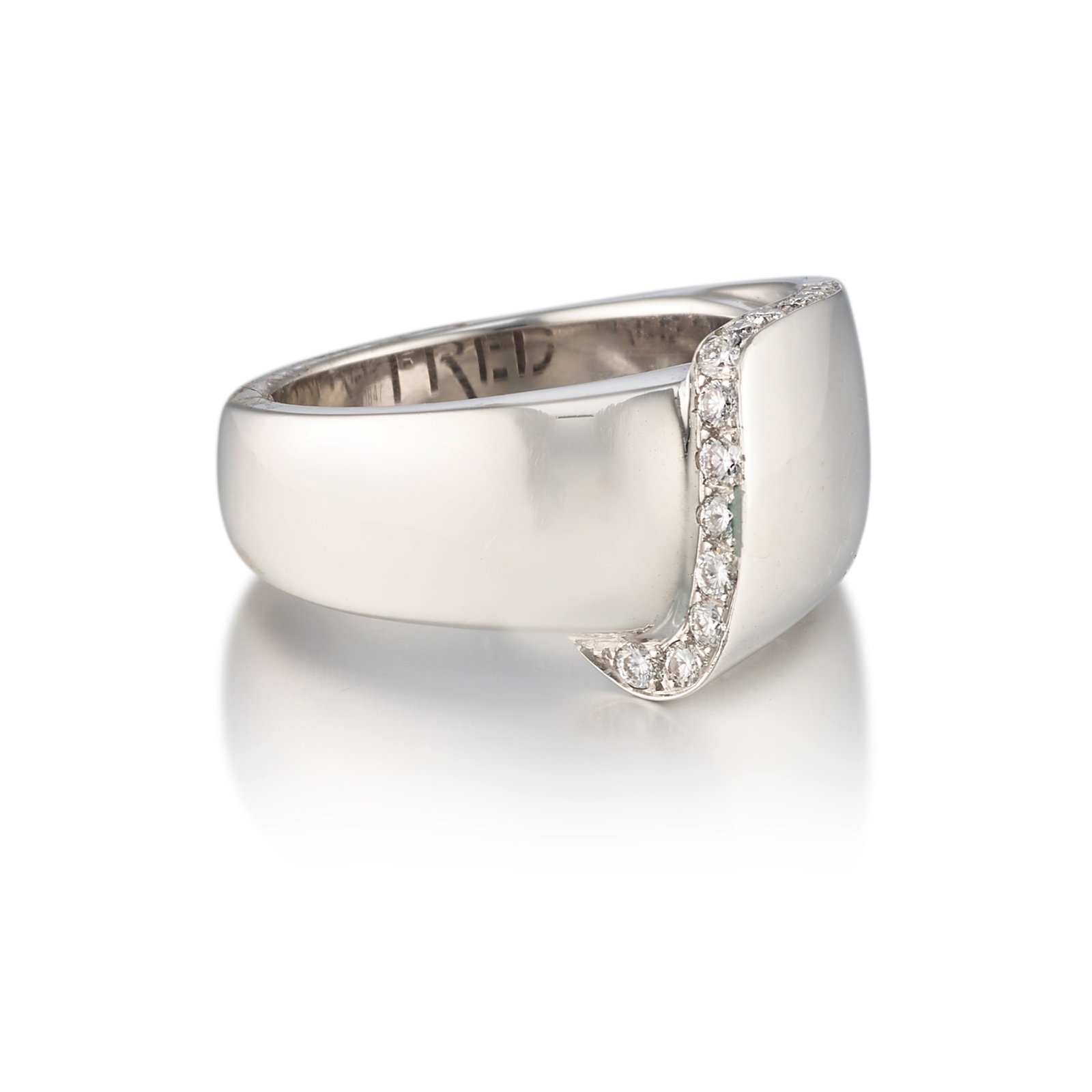 FRED PARIS: AN 18K WHITE GOLD AND DIAMOND RING: FRED PARIS: AN 18K WHITE GOLD AND DIAMOND RING Accented with round brilliant-cut diamonds; with proprietary signature; with maker's mark; with partial French assay mark; with serial number; estimated 