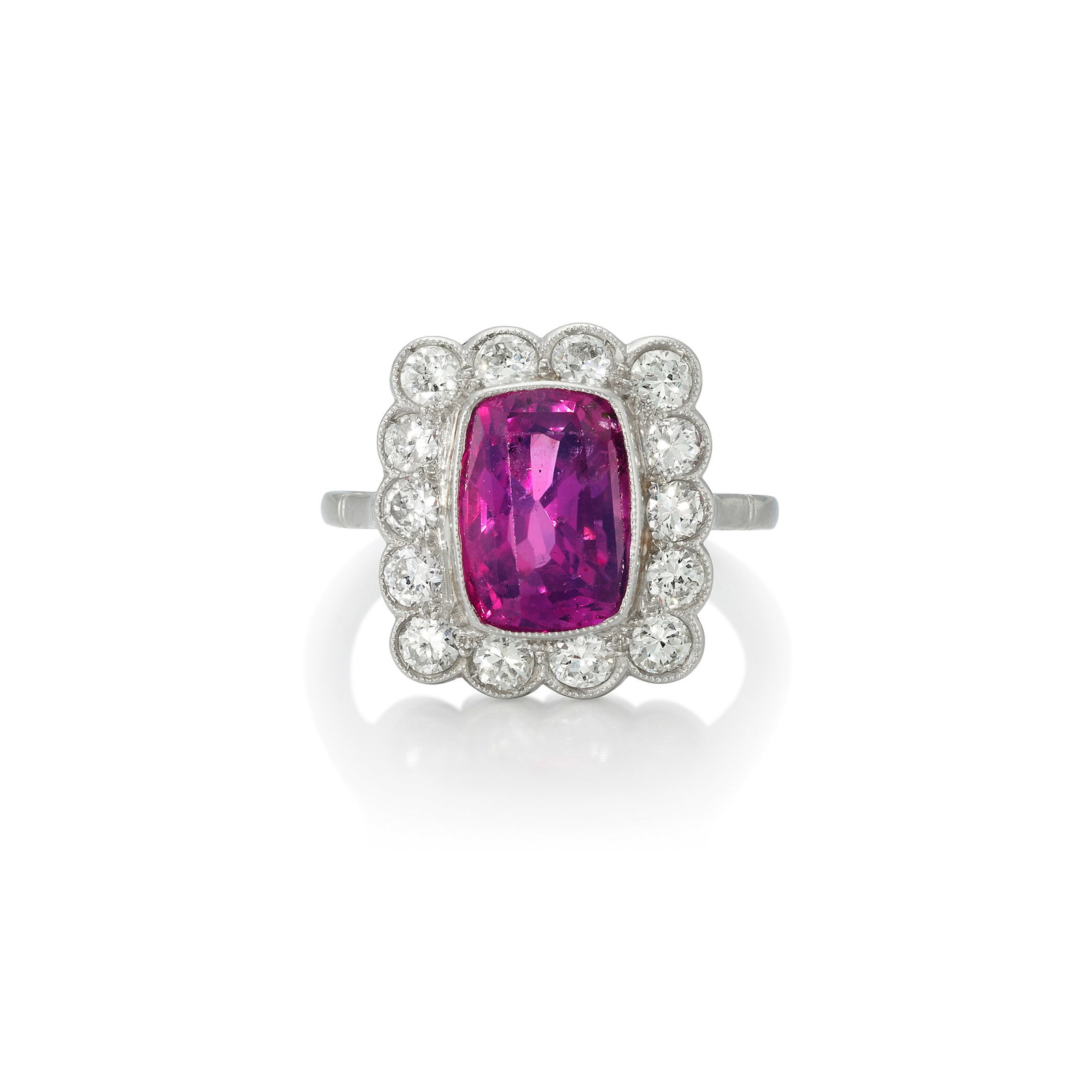 A PINK SAPPHIRE AND DIAMOND RING: A PINK SAPPHIRE AND DIAMOND RING Centering a cushion-shaped pink sapphire, weighing approximately 4.02 carats, surrounded by old European and circular-cut diamonds; mounted in platinum; size 7 1/2
