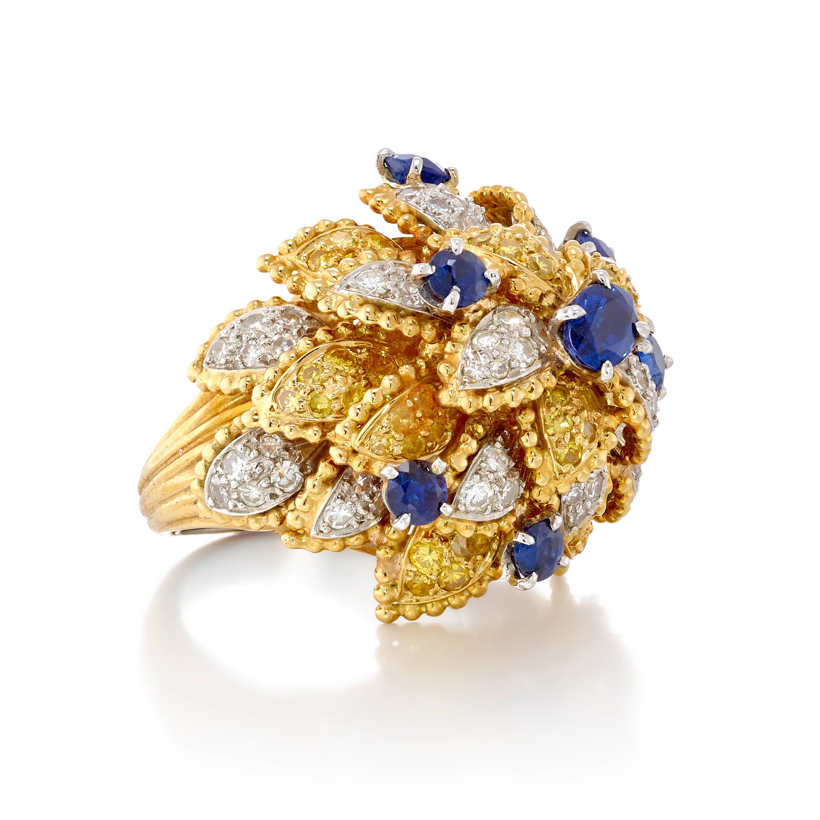 A SAPPHIRE, DIAMOND AND COLORED DIAMOND RING: A SAPPHIRE, DIAMOND AND COLORED DIAMOND RING Of bombé style, designed as a flower with petals of single-cut diamonds, some of yellow hue, accented across with round and oval-shaped sapphires; est