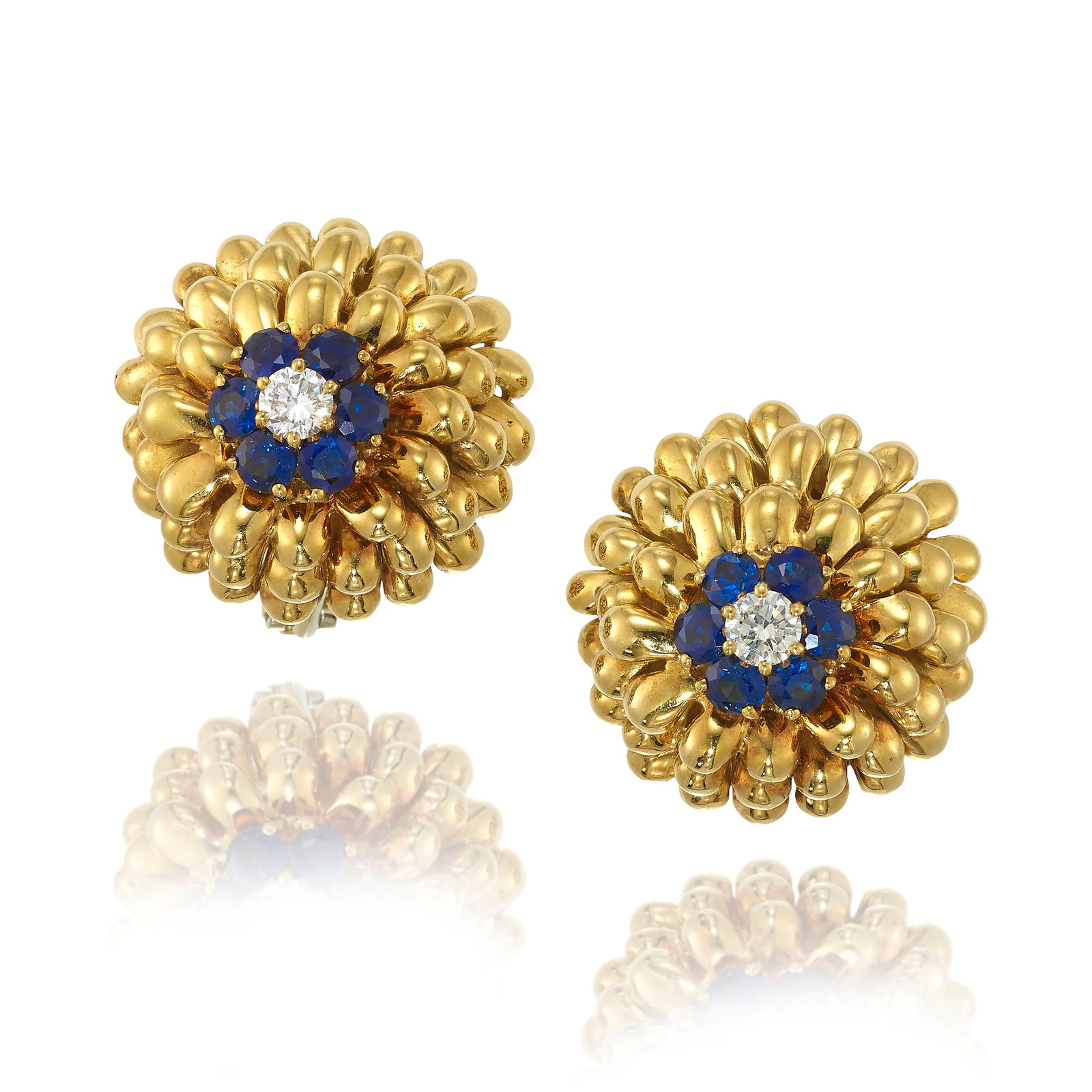A PAIR OF 18K GOLD, SAPPHIRE AND DIAMOND EARRINGS: A PAIR OF 18K GOLD, SAPPHIRE AND DIAMOND EARRINGS Each designed as flowers, centering a cluster of round sapphires and a round brilliant-cut diamond; with Italian registered trademark for Ceva Gioiell