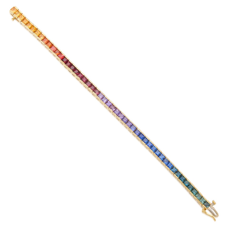 14K YELLOW GOLD AND SAPPHIRE BRACELET: 14K YELLOW GOLD AND SAPPHIRE BRACELET • Numerous square shaped sapphires weighing approximately 9 carats total • Length 7 in. • Estimated gross weight: 23.9 grams Footnotes: OVERALL