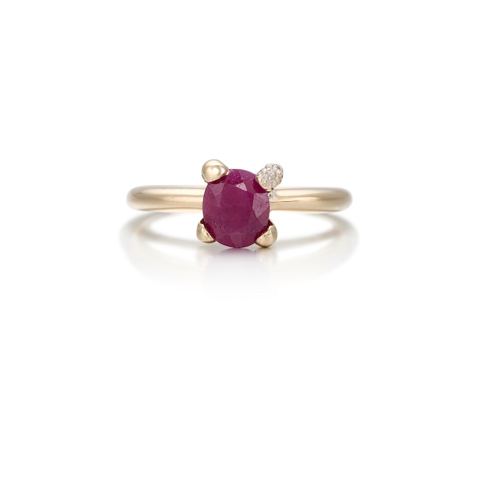 18K WHITE GOLD, RUBY AND DIAMOND RING: 18K WHITE GOLD, RUBY AND DIAMOND RING • One oval shaped ruby weighing approximately 1.20 carats total • Eighteen round brilliant cut diamonds weighing approximately 0.09 carat