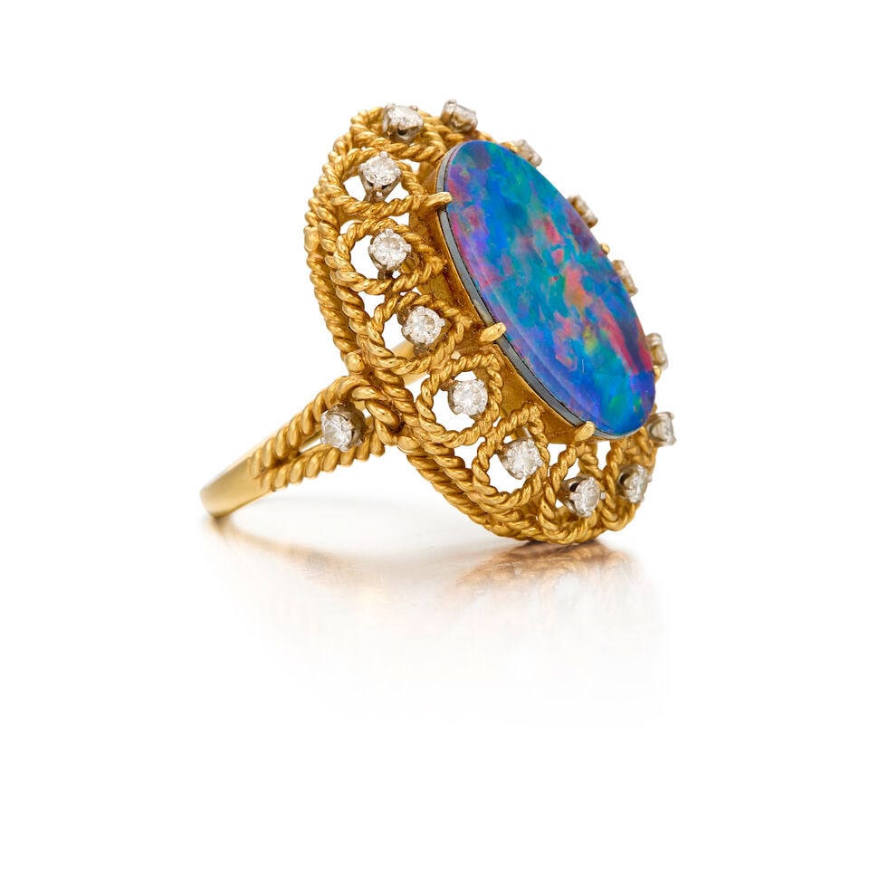 RAYMOND YARD: A 18K YELLOW GOLD, OPAL DOUBLET, AND DIAMOND RING, CIRCA 1940 - 2