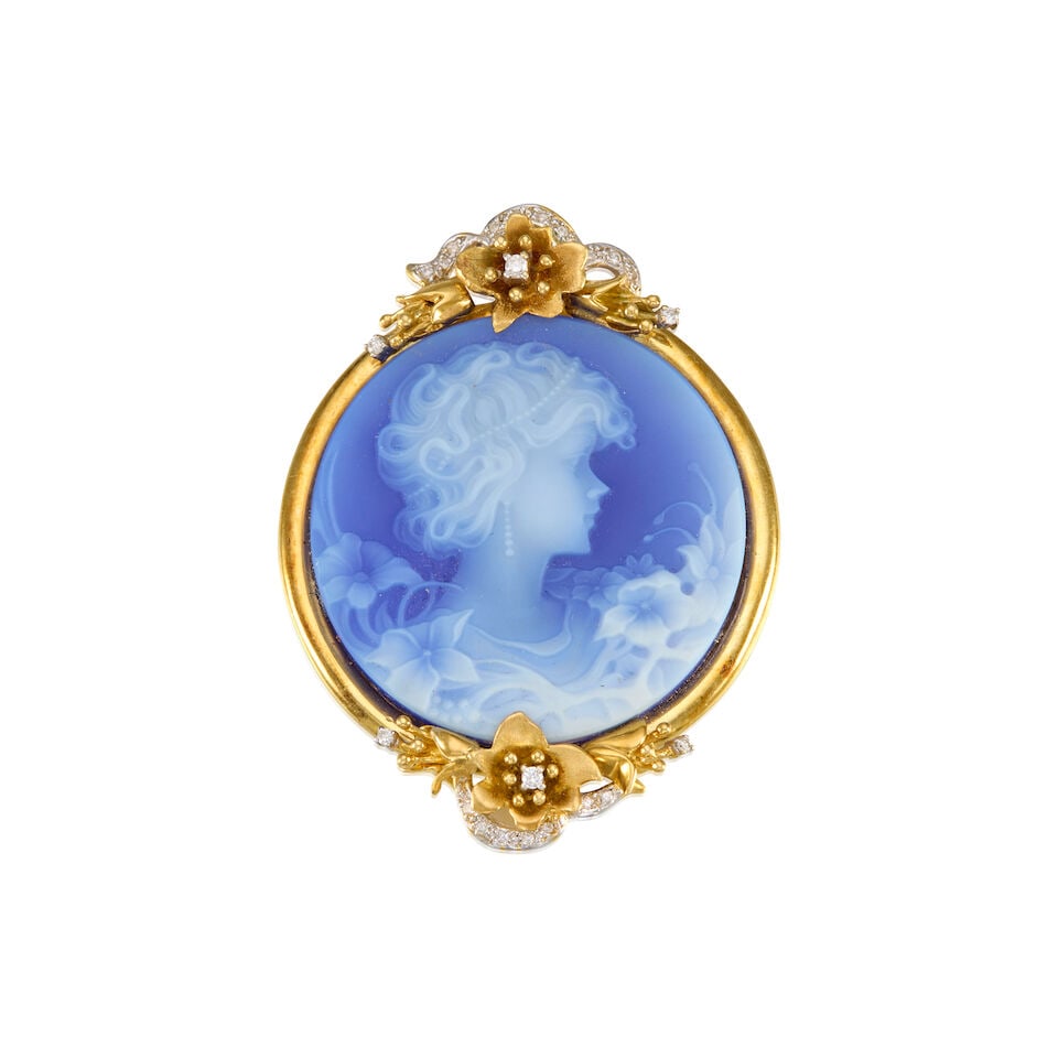 18K YELLOW GOLD, CHALCEDONY, AND DIAMOND CAMEO BROOCH: 18K YELLOW GOLD, CHALCEDONY, AND DIAMOND CAMEO BROOCH • One carved chalcedony cameo measuring approximately 35.10mm in diameter • Numerous round shaped and melee diamonds • Can be
