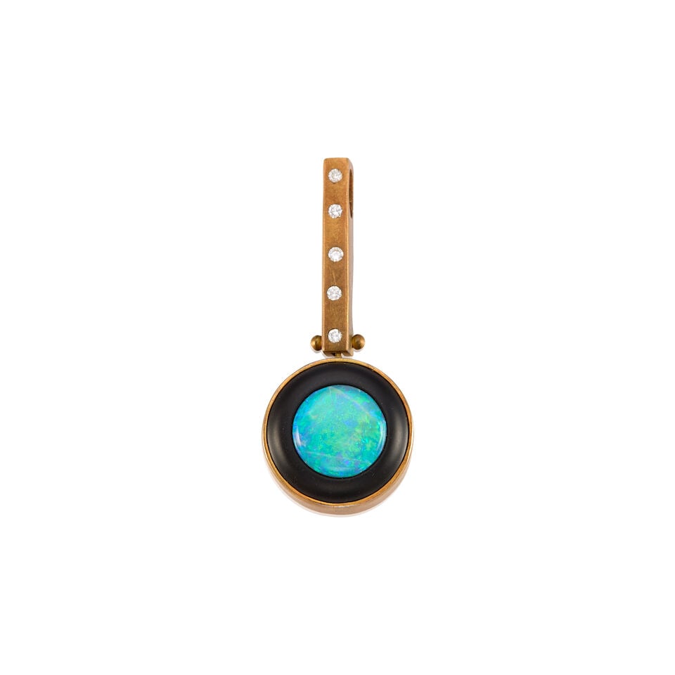 R. GREENE: 18K YELLOW GOLD, OPAL, ONYX AND DIAMOND PENDANT: R. GREENE: 18K YELLOW GOLD, OPAL, ONYX AND DIAMOND PENDANT • One round cabochon shaped opal measuring approximately 9.95mm in diameter surrounded by onyx measuring approximately 3.00mm in width