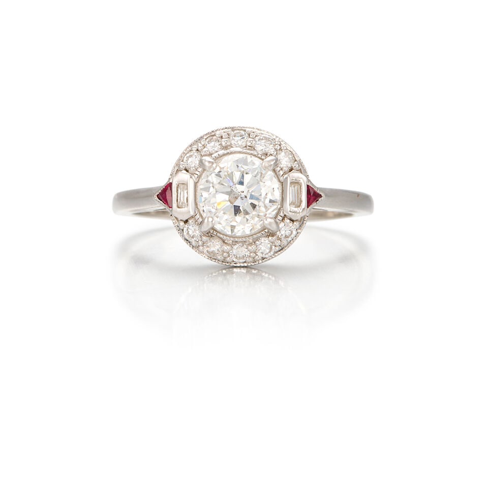 18K WHITE GOLD, DIAMOND, AND RUBY RING: 18K WHITE GOLD, DIAMOND, AND RUBY RING • One round brilliant cut diamond weighing approximately 0.75 carat • Numerous round and rectangular shaped diamonds weighing approximately 0.13