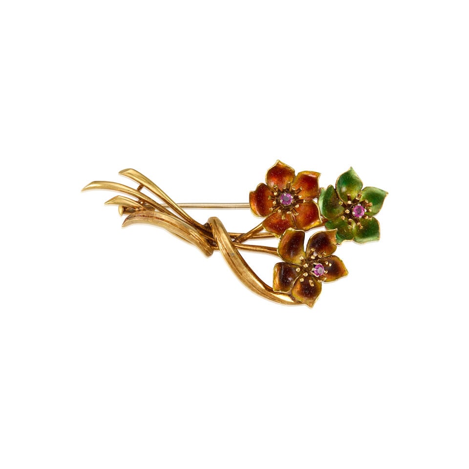 18K YELLOW GOLD, ENAMEL, AND RUBY BROOCH: 18K YELLOW GOLD, ENAMEL, AND RUBY BROOCH • Three round shaped rubies weighing approximately 0.06 carat total • Enamel on the three flowers • Measure 2 1/4 in. x 1 in. •