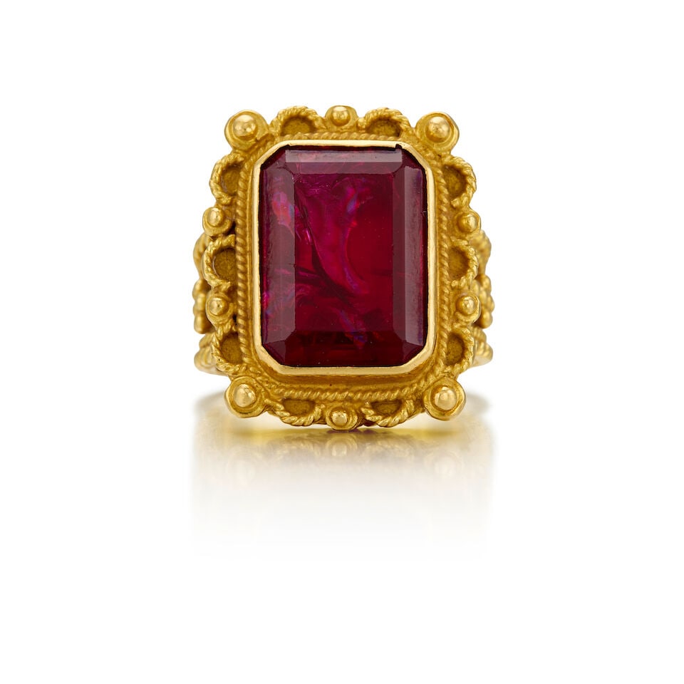 18K YELLOW GOLD AND GLASS FILLED RUBY: 18K YELLOW GOLD AND GLASS FILLED RUBY • One rectangular shaped glass filled ruby measuring approximately 15.35mm x 11.45mm • Size 7 • Estimated gross weight: 17.7