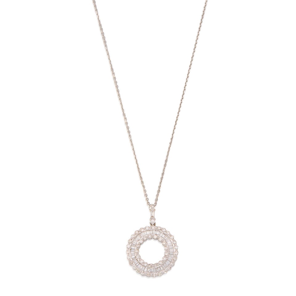 GOLD AND DIAMOND PENDANT NECKLACE: GOLD AND DIAMOND PENDANT NECKLACE • A 18K white gold pendant with numerous round and rectangular shaped diamonds weighing approximately 0.95 carat total, measures 1 1/16 in. x 3/4 in. • A