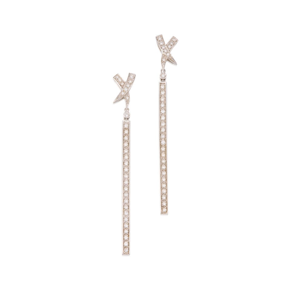 17K WHITE GOLD AND DIAMOND EARRINGS: 17K WHITE GOLD AND DIAMOND EARRINGS • Sixty two round brilliant cut diamonds weighing approximately 1.24 carats total • Measures 2 3/4 in. x 1/4 in. • Estimated gross weight: 8.4