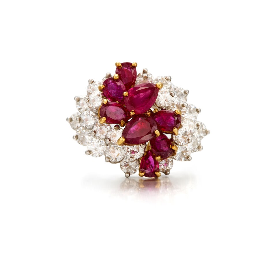 A RUBY AND DIAMOND RING: A RUBY AND DIAMOND RING • 10K yellow gold and platinum • Eight pear-shaped rubies weighing approximately 1.85 carats total • Numerous round shaped diamonds weighing approximately 1.0