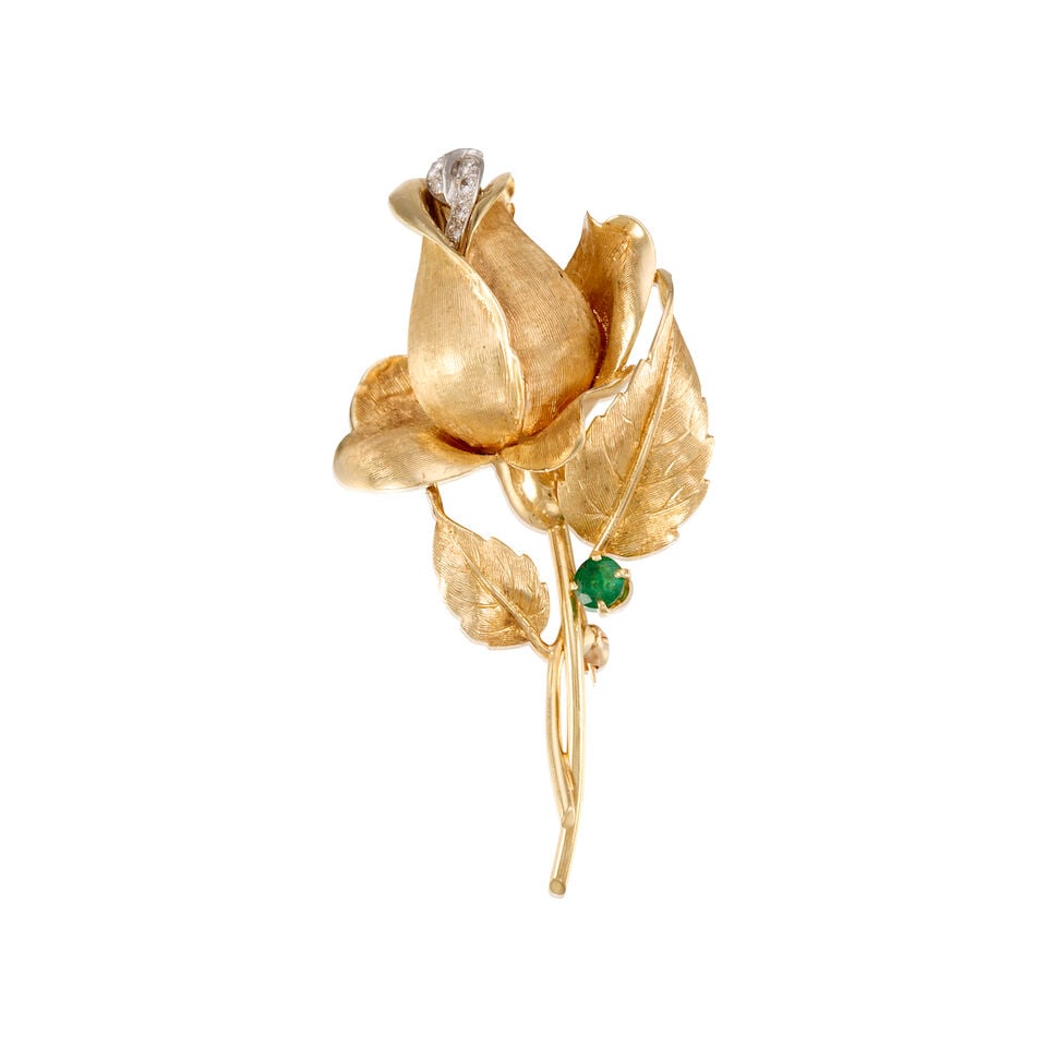14K YELLOW GOLD, EMERALD AND DIAMOND ROSE BROOCH: 14K YELLOW GOLD, EMERALD AND DIAMOND ROSE BROOCH • One round shaped emerald weighing approximately 0.20 carat total • Seven round brilliant cut diamonds weighing approximately 0.18 carat