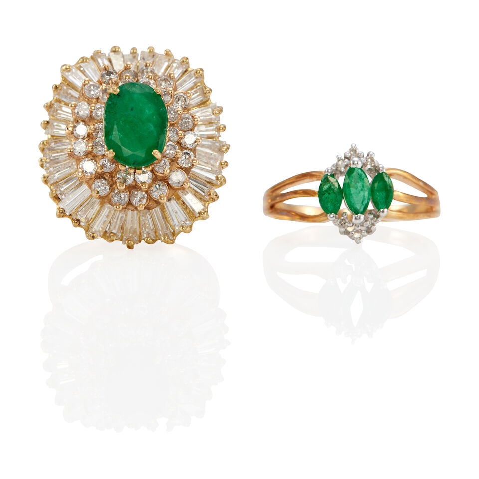 TWO 14K GOLD, EMERALD, AND DIAMOND RINGS: TWO 14K GOLD, EMERALD, AND DIAMOND RINGS • One 14k yellow gold ring with one oval shaped emerald weighing approximately 1.30 carats, with 32 round diamonds weighing approximately 0.80 carat