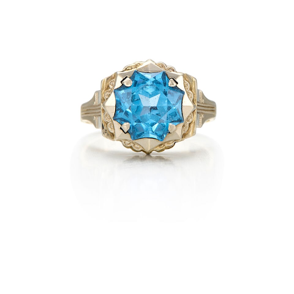 14K BICOLOR SYNTHETIC SPINEL RING: 14K BICOLOR SYNTHETIC SPINEL RING • 14K yellow and white gold • One round shaped synthetic spinel weighing approximately 3.54 carats total • Size 5 3/4 • Estimated gross weight