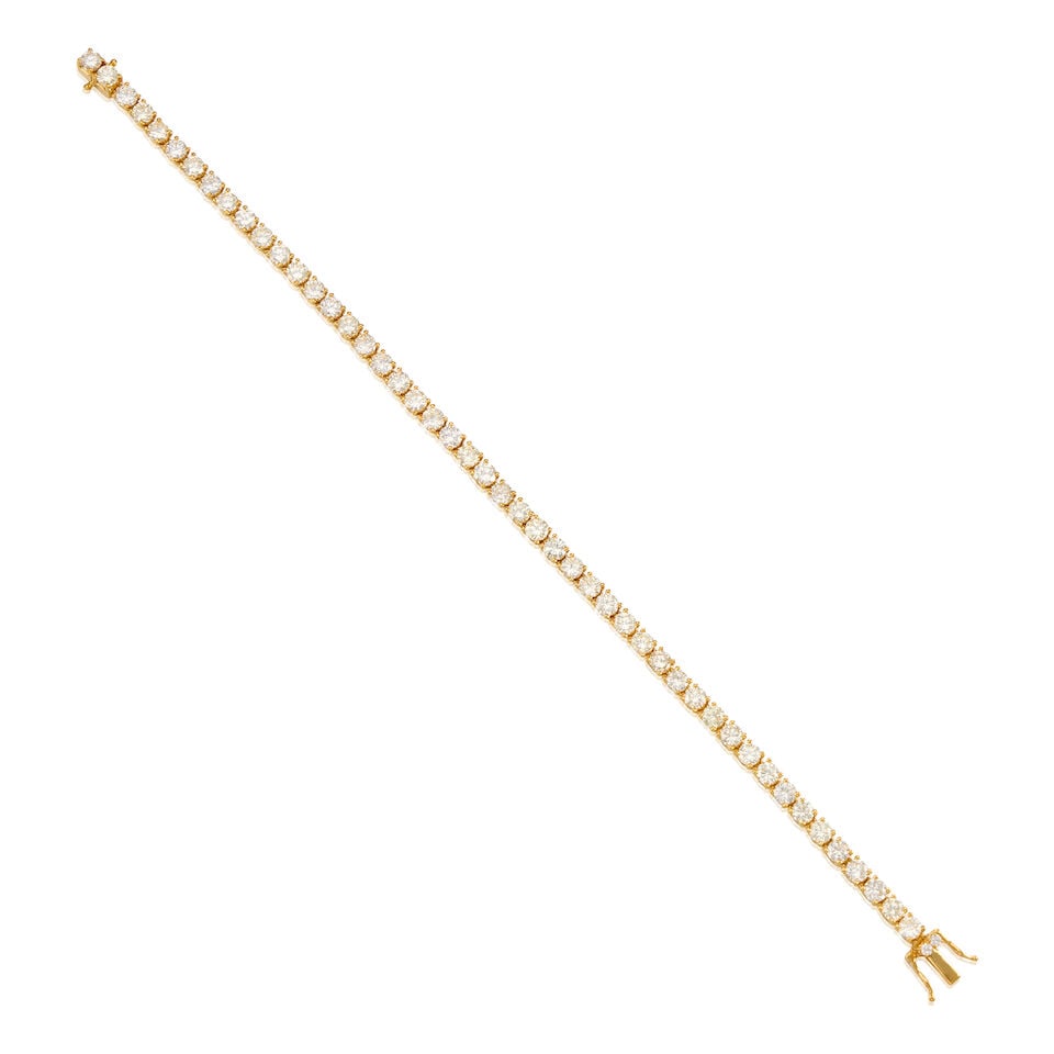 18K YELLOW GOLD AND DIAMOND BRACELET: 18K YELLOW GOLD AND DIAMOND BRACELET • Numerous round brilliant cut diamonds weighing approximately 4.80 carats total • Length 7 3/16 in. • Estimated gross weight: 10.6 grams Footnot
