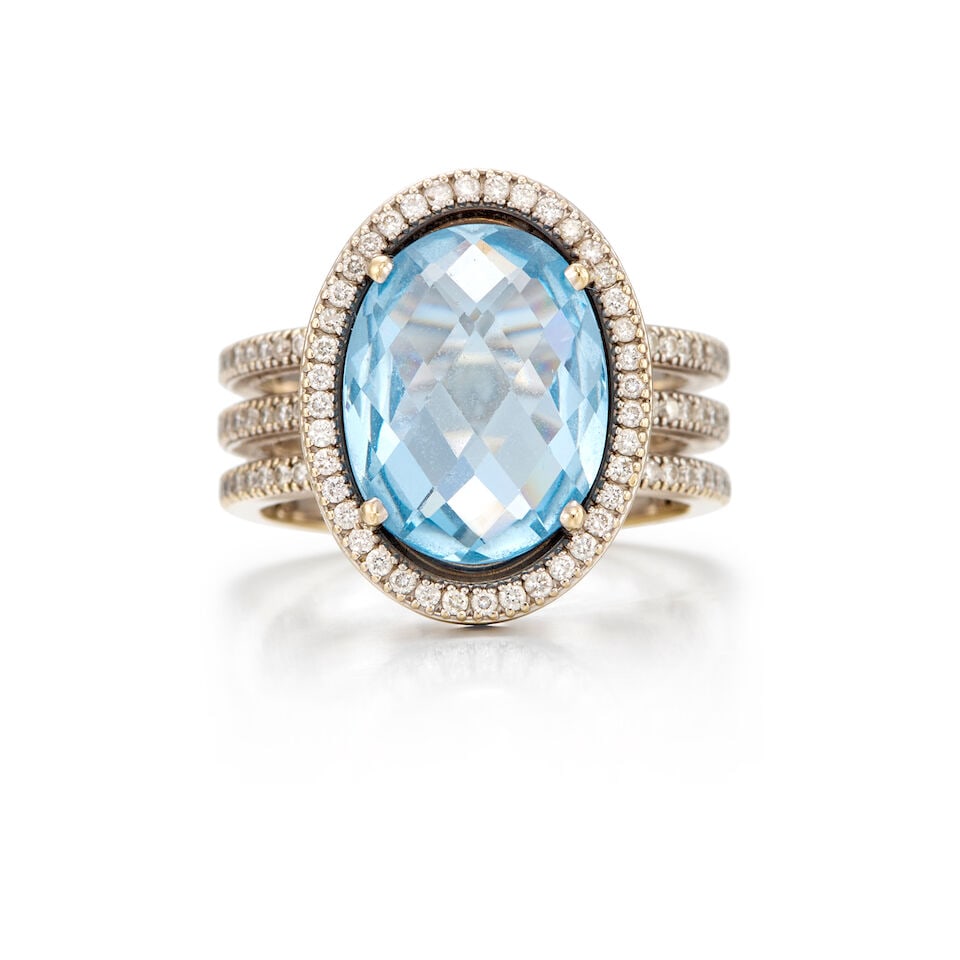 18K WHITE GOLD, SYNTETIC SPINEL AND DIAMOND RING: 18K WHITE GOLD, SYNTETIC SPINEL AND DIAMOND RING • One oval rose cut synthetic spinel weighing approximately 4.95 carats total • Numerous round brilliant diamonds measuring approximately