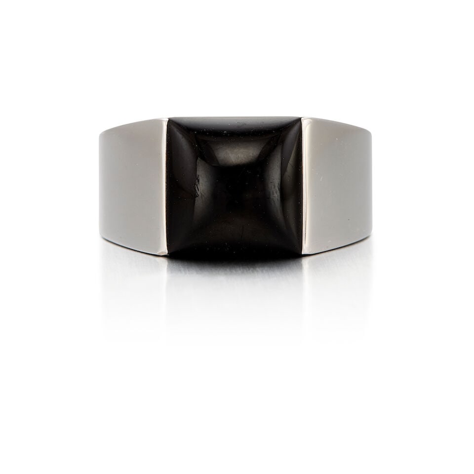 CARTIER: 18K WHITE GOLD AND ONYX RING: CARTIER: 18K WHITE GOLD AND ONYX RING • One square shaped onyx measuring approximately 12.28mm x 12.24mm x 4.63mm • Stamped CARTIER 1998, with serial number • Size 9 1/4 •