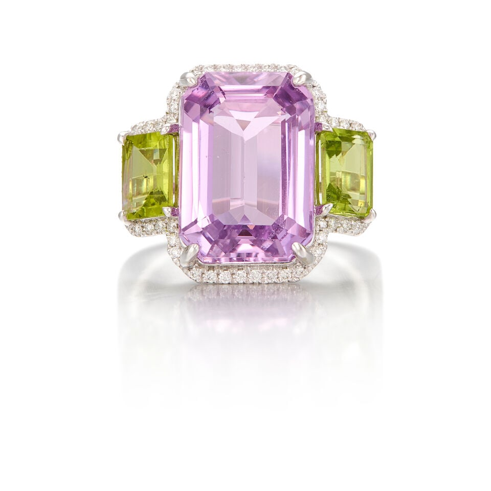 PLATINUM, KUNZITE, PERIDOT AND DIAMOND RING: PLATINUM, KUNZITE, PERIDOT AND DIAMOND RING • One rectangular step cut kunzite weighing approximately 9.25 carats total • Two rectangular step cut peridot weighing approximately 1.66