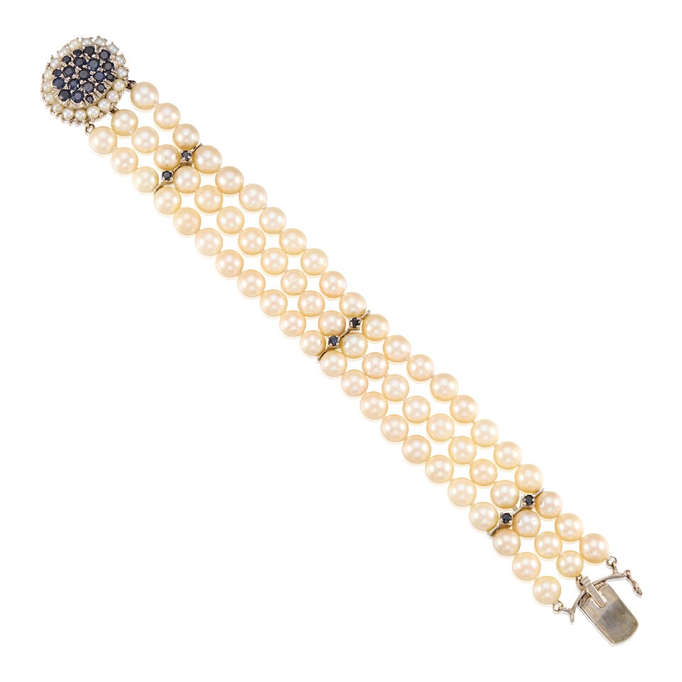 13K WHITE GOLD, CULTURED PEARL, AND SAPPHIRE BRACELET: 13K WHITE GOLD, CULTURED PEARL, AND SAPPHIRE BRACELET • Numerous cultured pearls measuring approximately 3.50mm to 6.60mm in diameter • Numerous round shaped sapphires measuring