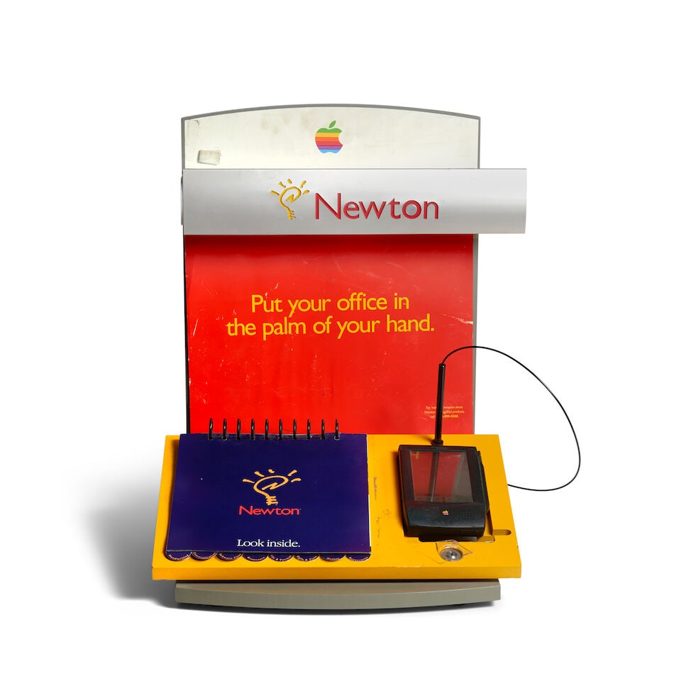 AN APPLE NEWTON MESSAGEPAD WITH MARKETING DISPLAY AND OTHER PROMOTIONAL MATERIAL. Apple Newton M...: AN APPLE NEWTON MESSAGEPAD WITH MARKETING DISPLAY AND OTHER PROMOTIONAL MATERIAL. Apple Newton MessagePad. Apple Computer, Inc.: Cupertino, CA / Japan, 1993. With stylus. 183 x 113 x 22 mm (7 1/4 x 4 