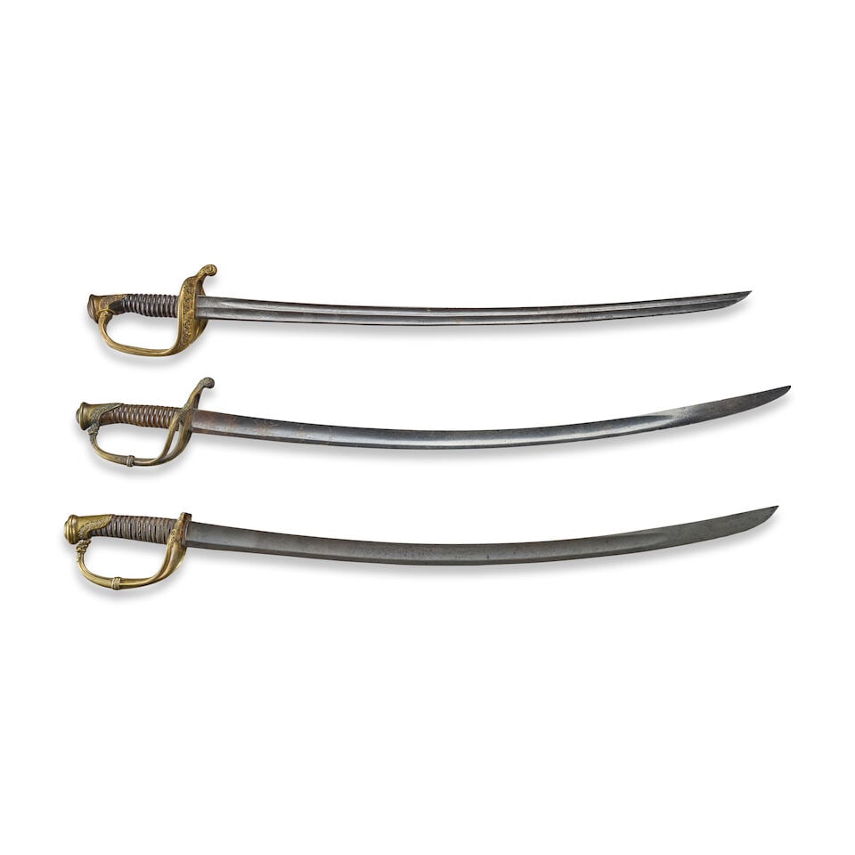 THREE 19TH CENTURY FRENCH OFFICER'S SABERS.: THREE 19TH CENTURY FRENCH OFFICER'S SABERS. A Model 1821 Officer's sword, brass hilt with floral molded quillon and branch, pommel cap with vine decoration, spiral carved horn grip with twisted brass 