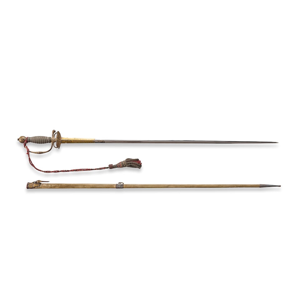 A CHASED AND GILDED 18TH CENTURY FRENCH STEEL HILTED SMALL SWORD WITH SCABBARD,: A CHASED AND GILDED 18TH CENTURY FRENCH STEEL HILTED SMALL SWORD WITH SCABBARD, c. 1760. The hilt with foliate decoration and gilded background details supporting braided red silk and metallic cord kn