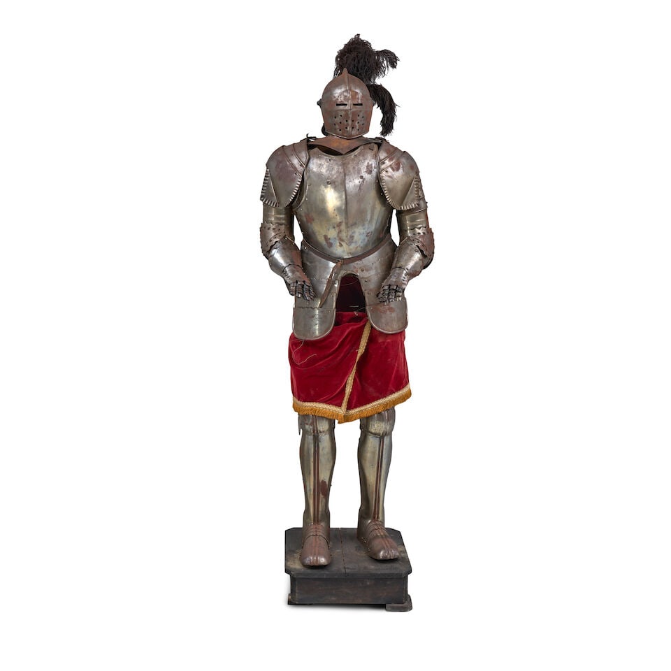 A VICTORIAN SUIT OF ARMOUR.: A VICTORIAN SUIT OF ARMOUR. The steel suit with articulated joints, gauntlets, and feet, supported on an internal wood armature. Ht. 76 in. For further information on this lot please visit