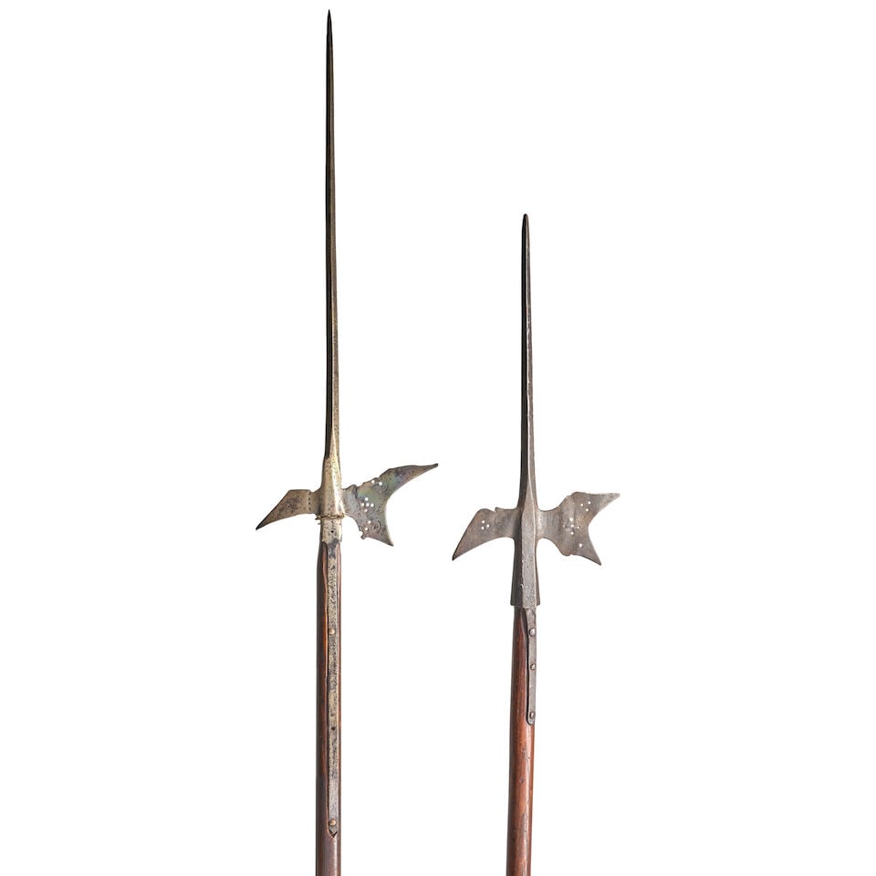 TWO LATE 17TH/EARLY 18TH CENTURY EUROPEAN HALBERDS WITH SHORTENED POLES.: TWO LATE 17TH/EARLY 18TH CENTURY EUROPEAN HALBERDS WITH SHORTENED POLES. The heads with tall narrow spikes above a socket with pierced crescent blade and angular beak and long straps secured to hard