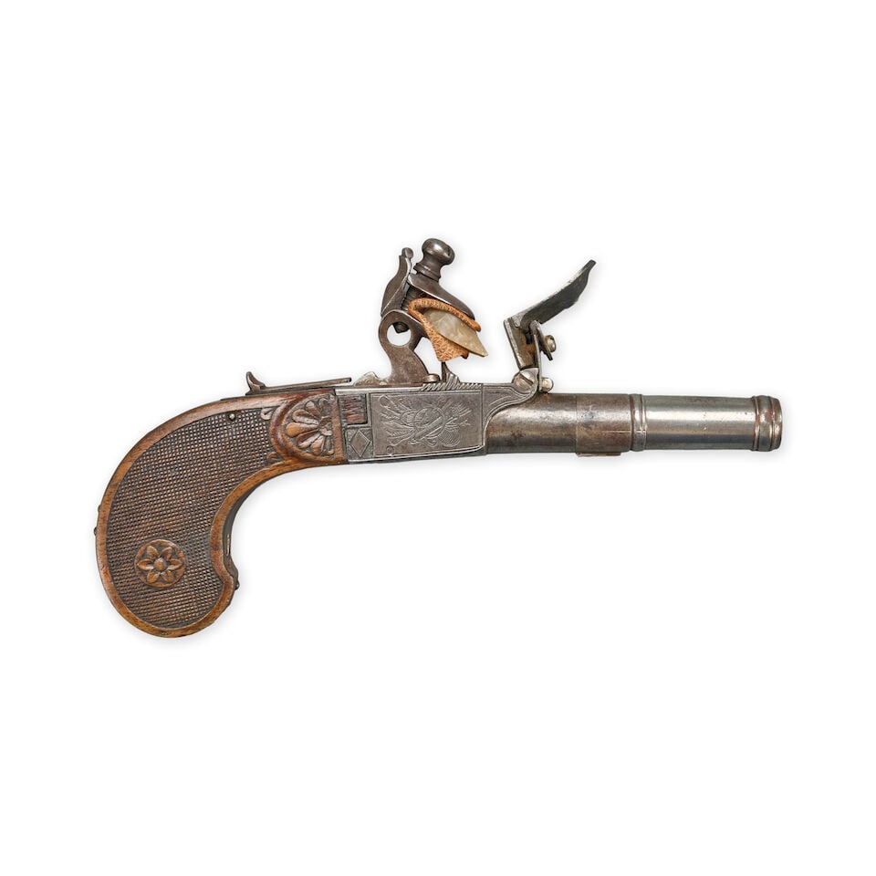 A LATE 18TH CENTURY BELGIAN FLINTLOCK POCKET PISTOL.: A LATE 18TH CENTURY BELGIAN FLINTLOCK POCKET PISTOL. 1 1/2 in., .48 caliber turn-off barrel on an iron frame with engraved hunting and martial imagery on the sides, checkered walnut grip with carved r