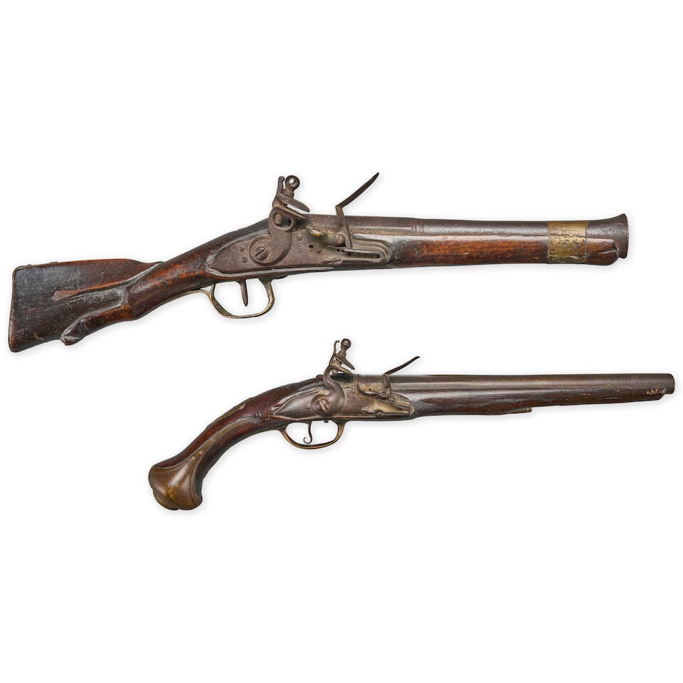 TWO 18TH/19TH CENTURY CONTINENTAL FLINTLOCK FIREARMS.: TWO 18TH/19TH CENTURY CONTINENTAL FLINTLOCK FIREARMS. A blunderbuss with an 11 in. barrel, French military-style lock, walnut stock with sling bar and brass furniture. Overall lg. 20 3/4 in. A long ho