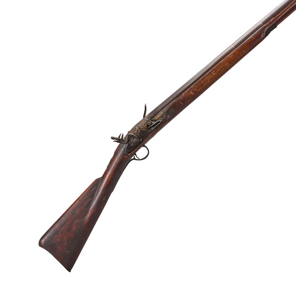 A LATE 18TH CENTURY AMERICAN MILITIA MUSKET.: A LATE 18TH CENTURY AMERICAN MILITIA MUSKET. 49 1/4 in., .75 caliber octagon to round barrel; replaced lock marked 'W.KETLAND'; cherry stock; brass furniture including a butt plate with an engraved an