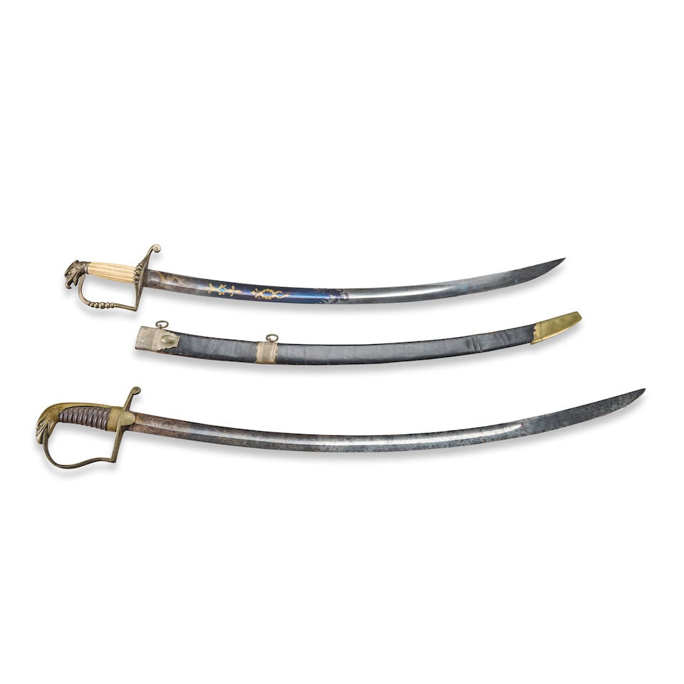 TWO EAGLE POMMEL SWORDS.: TWO EAGLE POMMEL SWORDS. A five-ball infantry officer's saber with silvered brass hilt and reeded bone grip; curved single-edge blade with false edge at the tip and single wide fuller, upper half of t